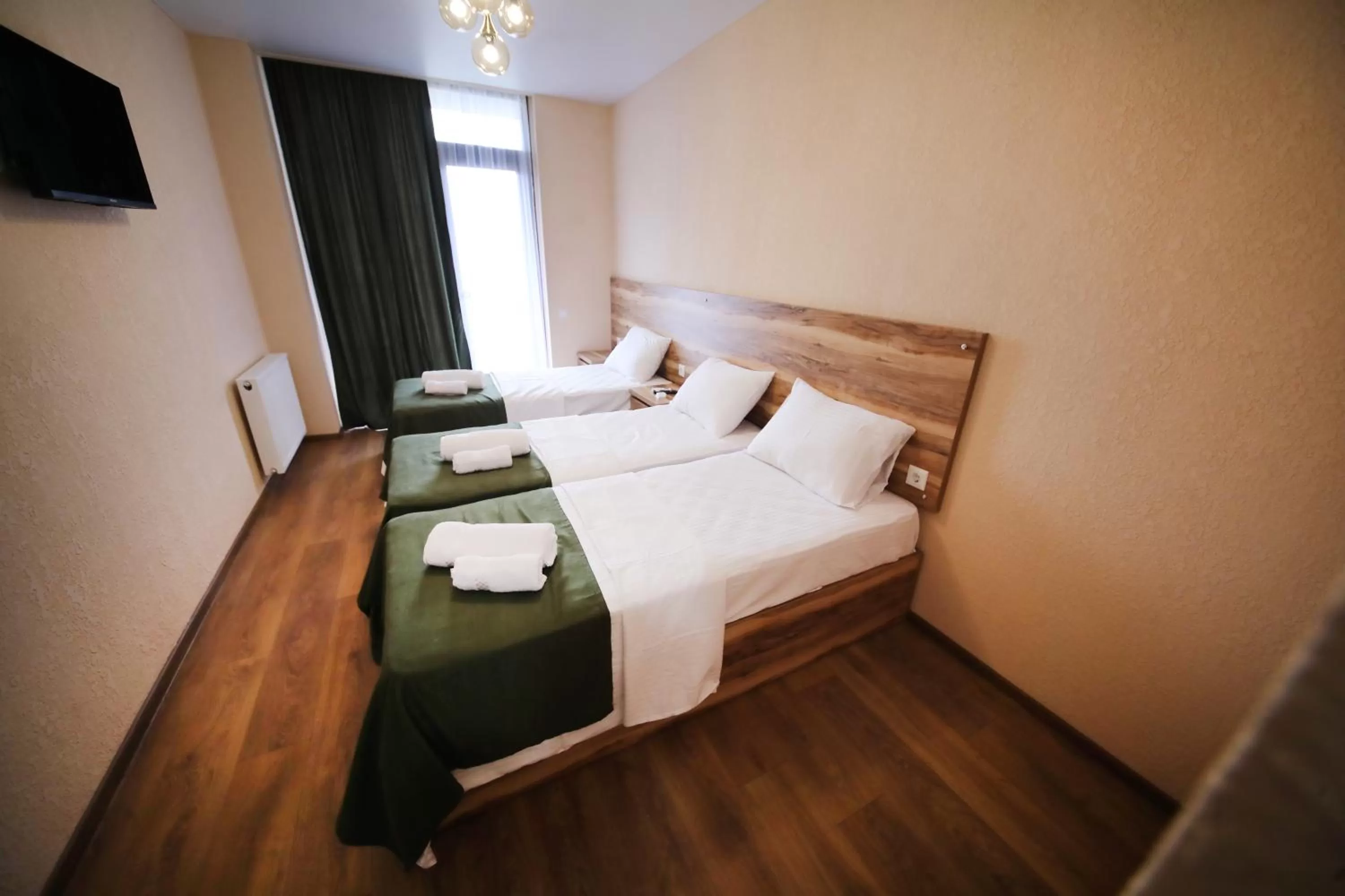 Bed in Bessarion Boutique Hotel