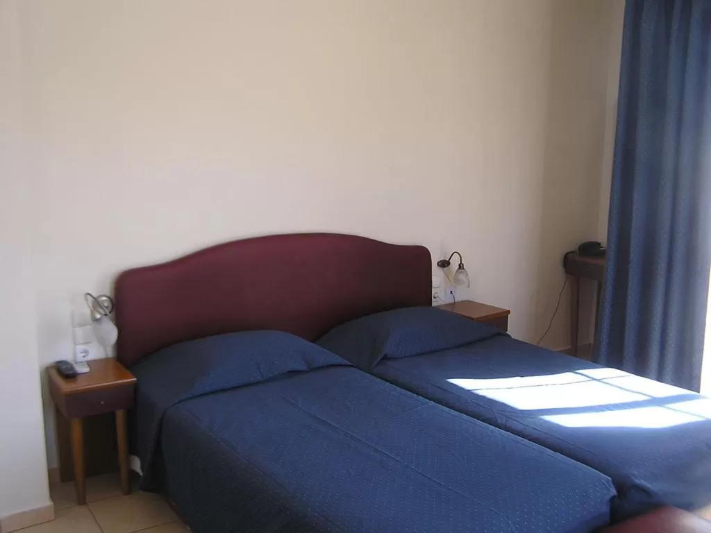 Bed in Polydoros Appartments