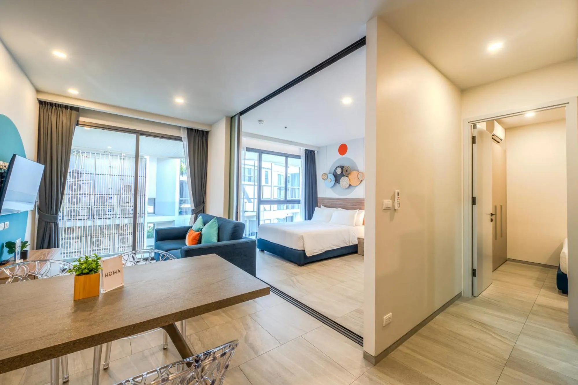 Living room, Bed in HOMA Phuket Town