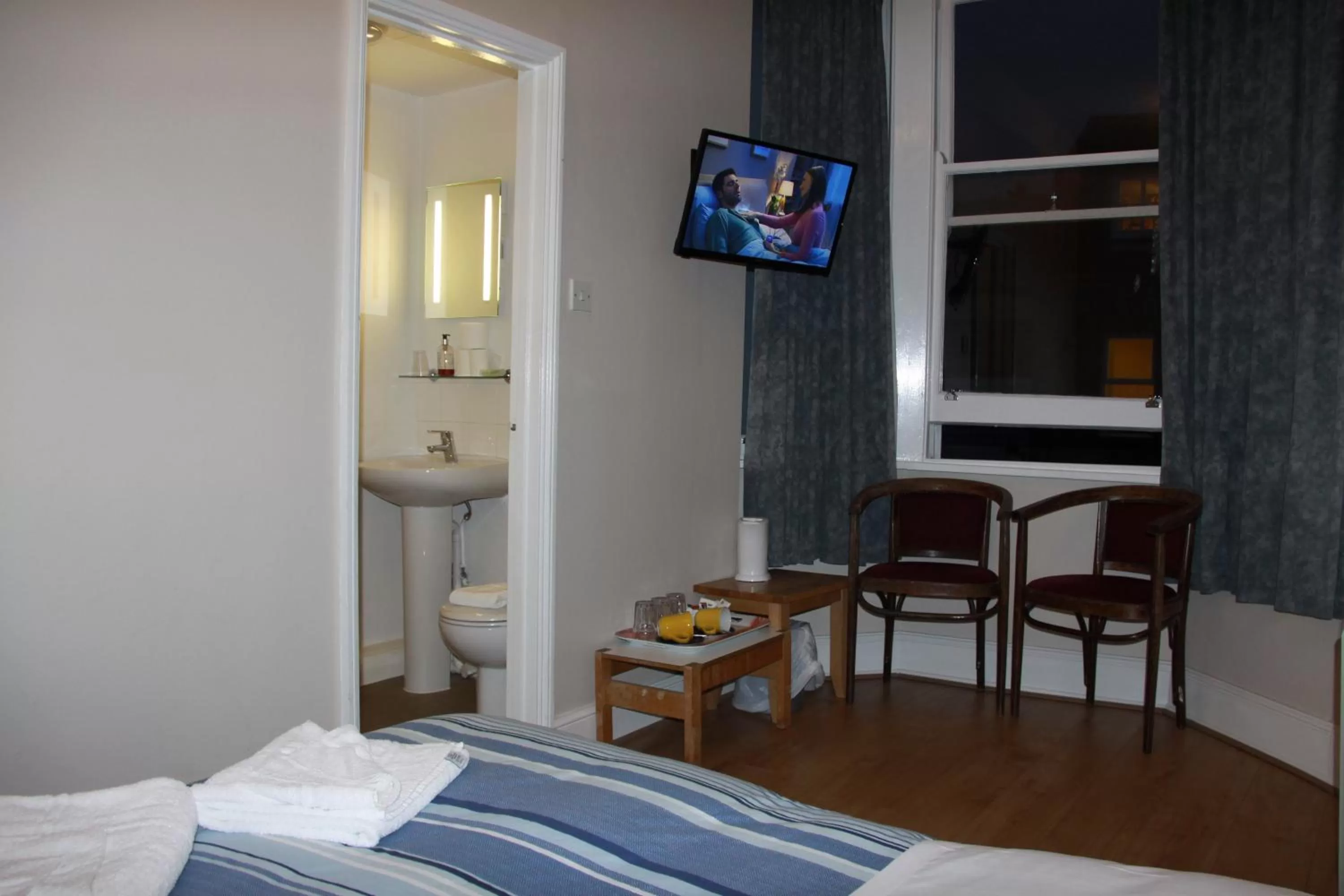 Bed in Ambassador Hotel