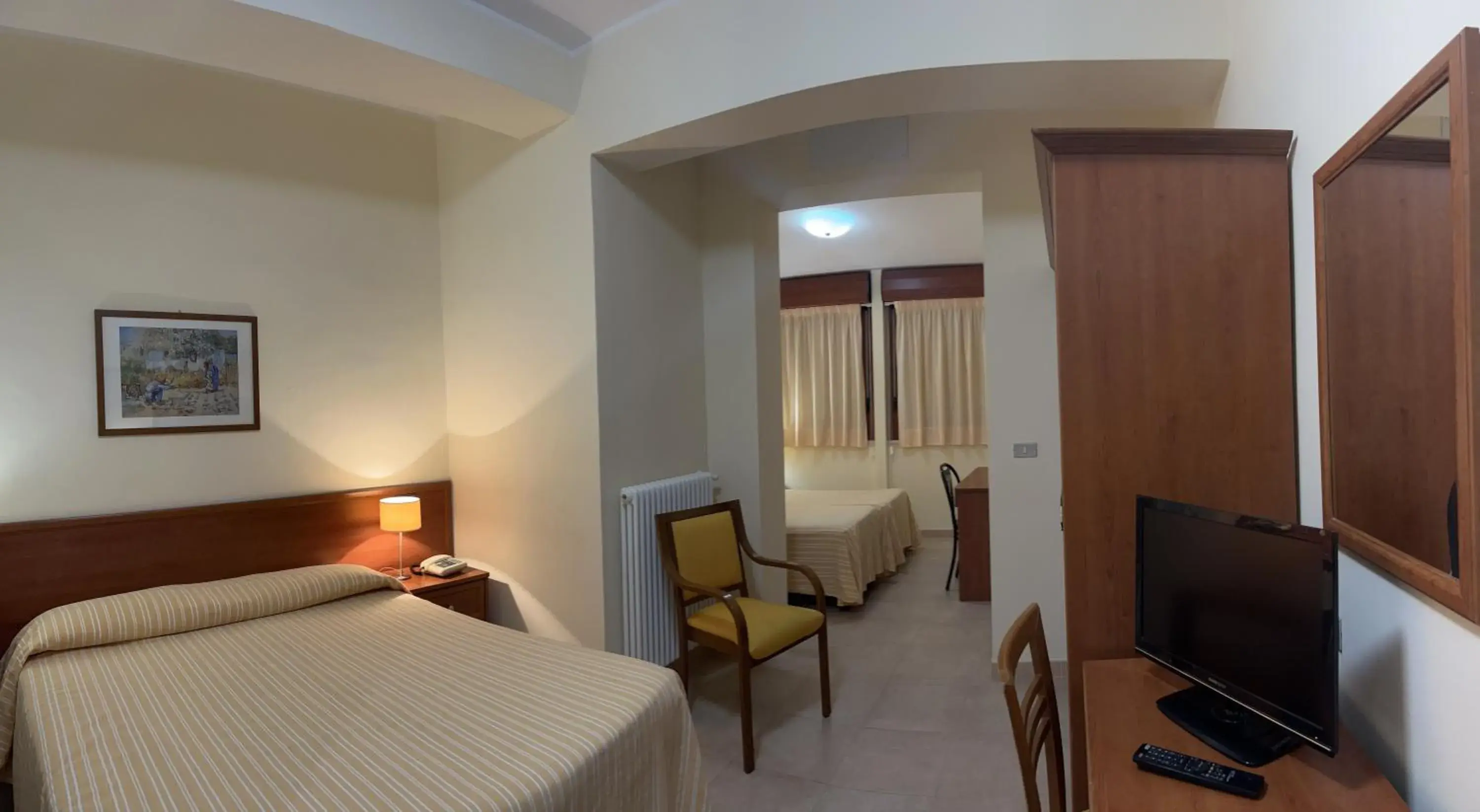 Standard Quadruple Room in Il Nocchiero City Hotel Standard Quadruple Room in Il Nocchiero City Hotel