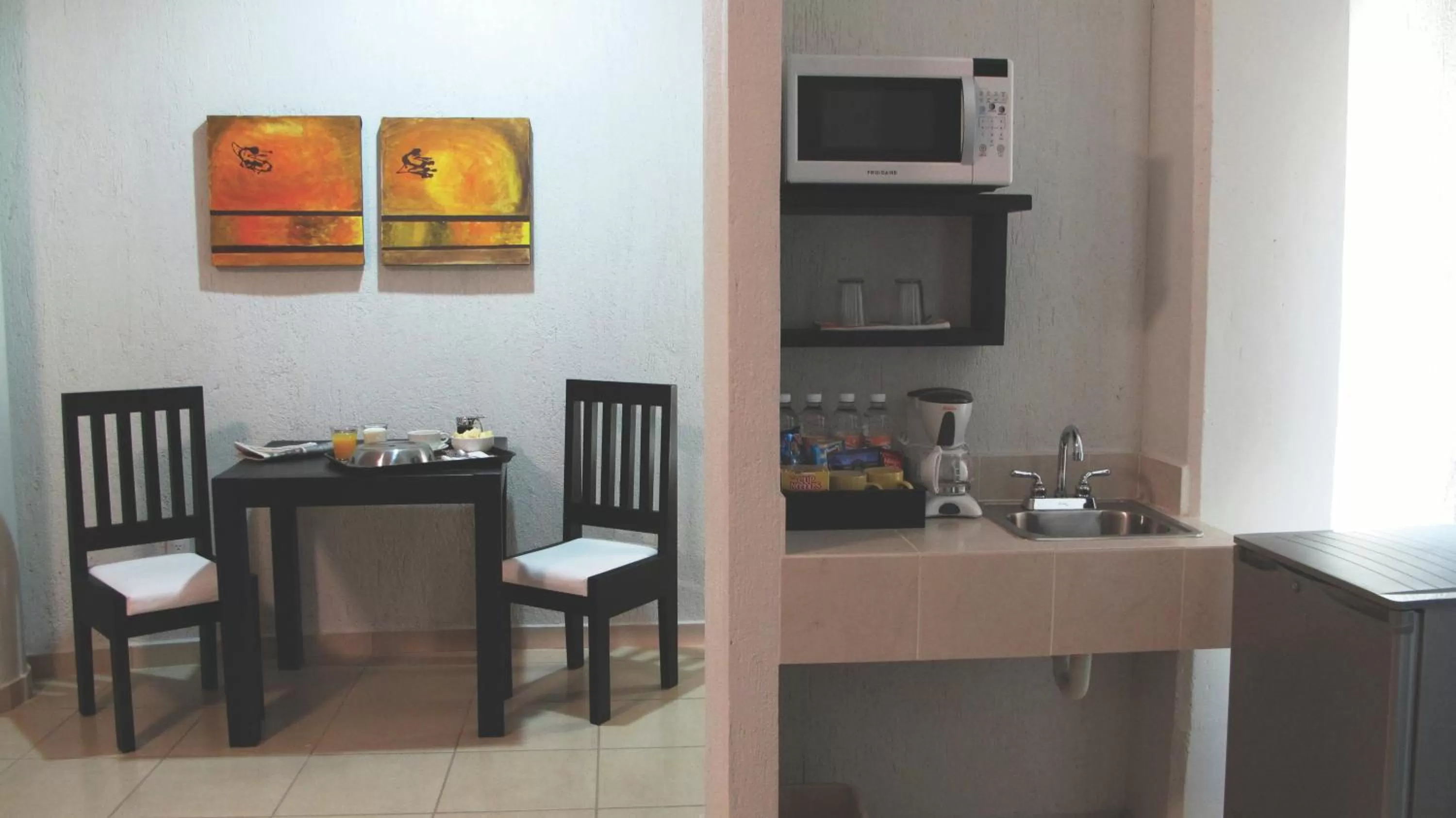 Kitchen or kitchenette in Hotel RS Suites