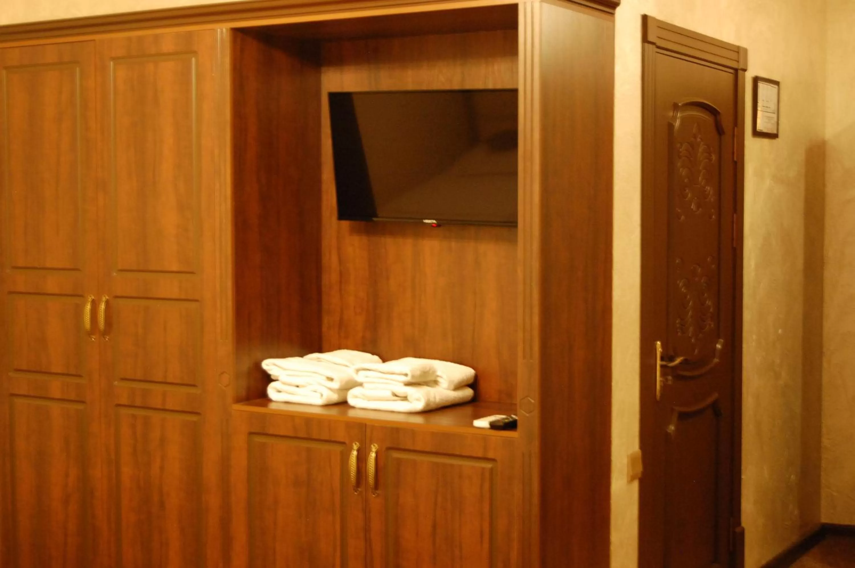 towels, TV/Entertainment Center in Usman