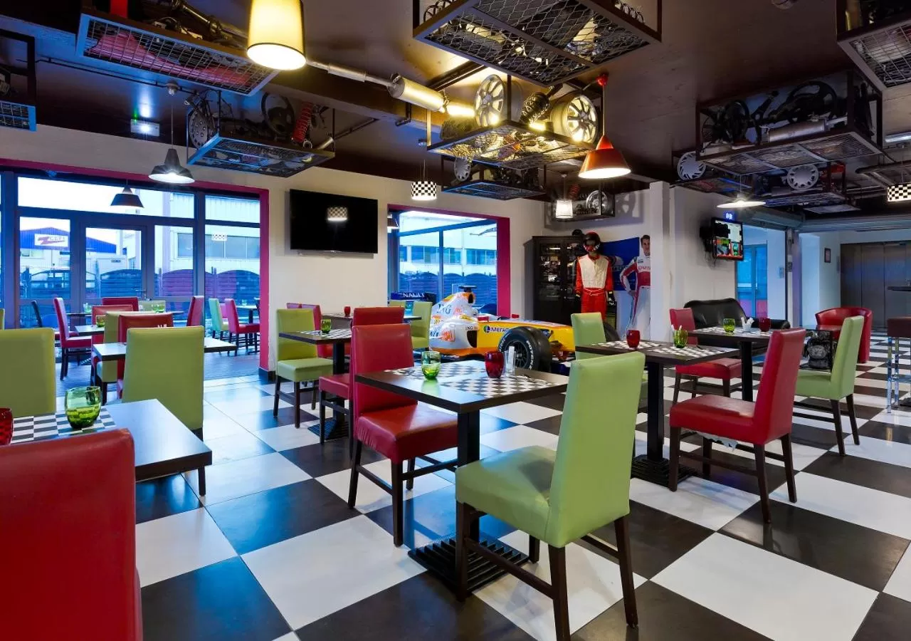 Property logo or sign in Enzo Hotels Reims Tinqueux by Kyriad Direct