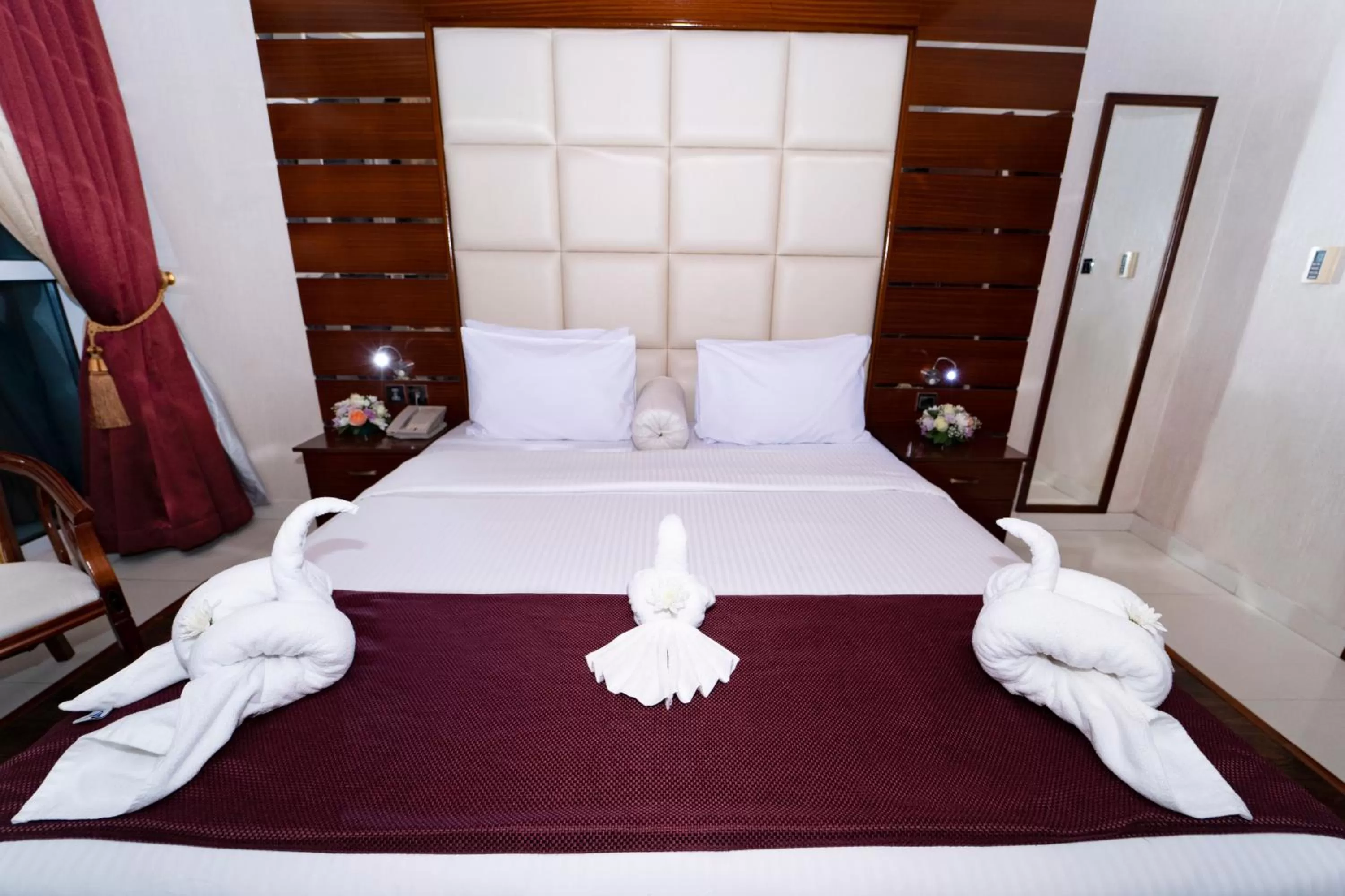 Bed in Queen Palace Hotel