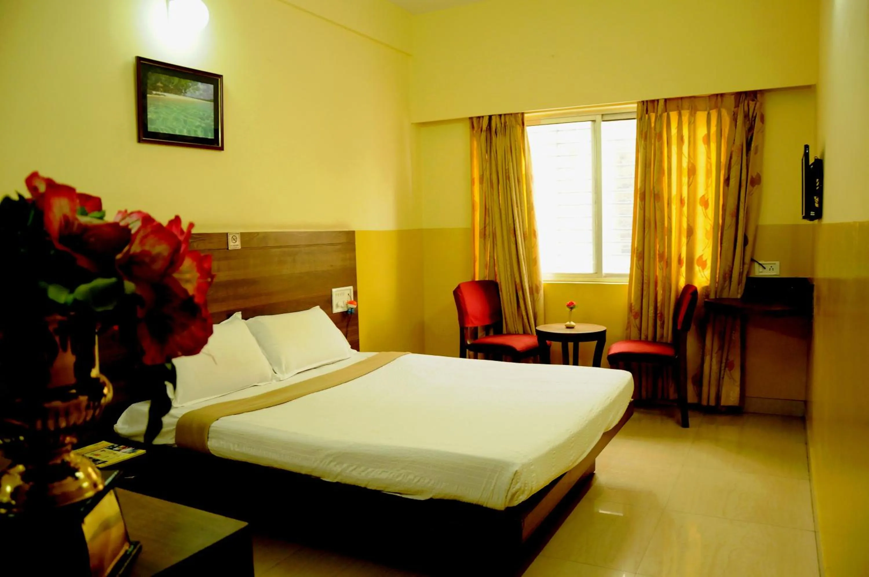 Photo of the whole room, Bed in Suvarna Residency