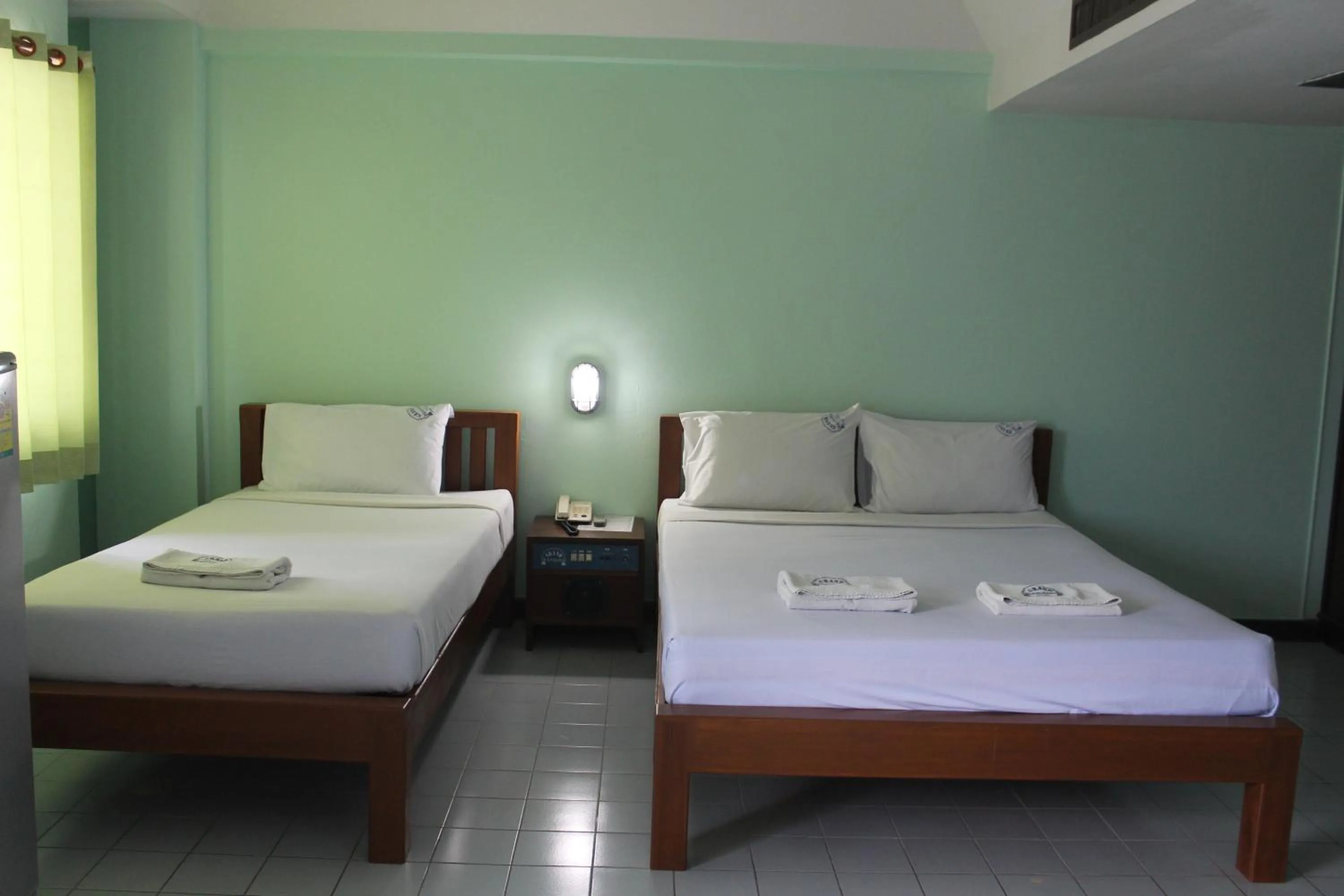 Bed in Grand Mansion Hotel