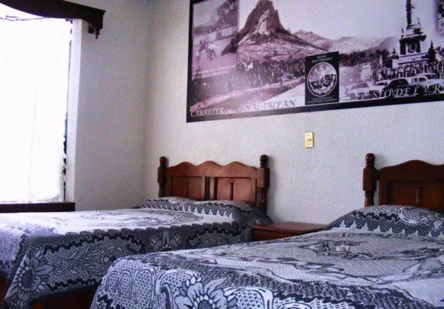 Bed in Hotel Don Porfirio