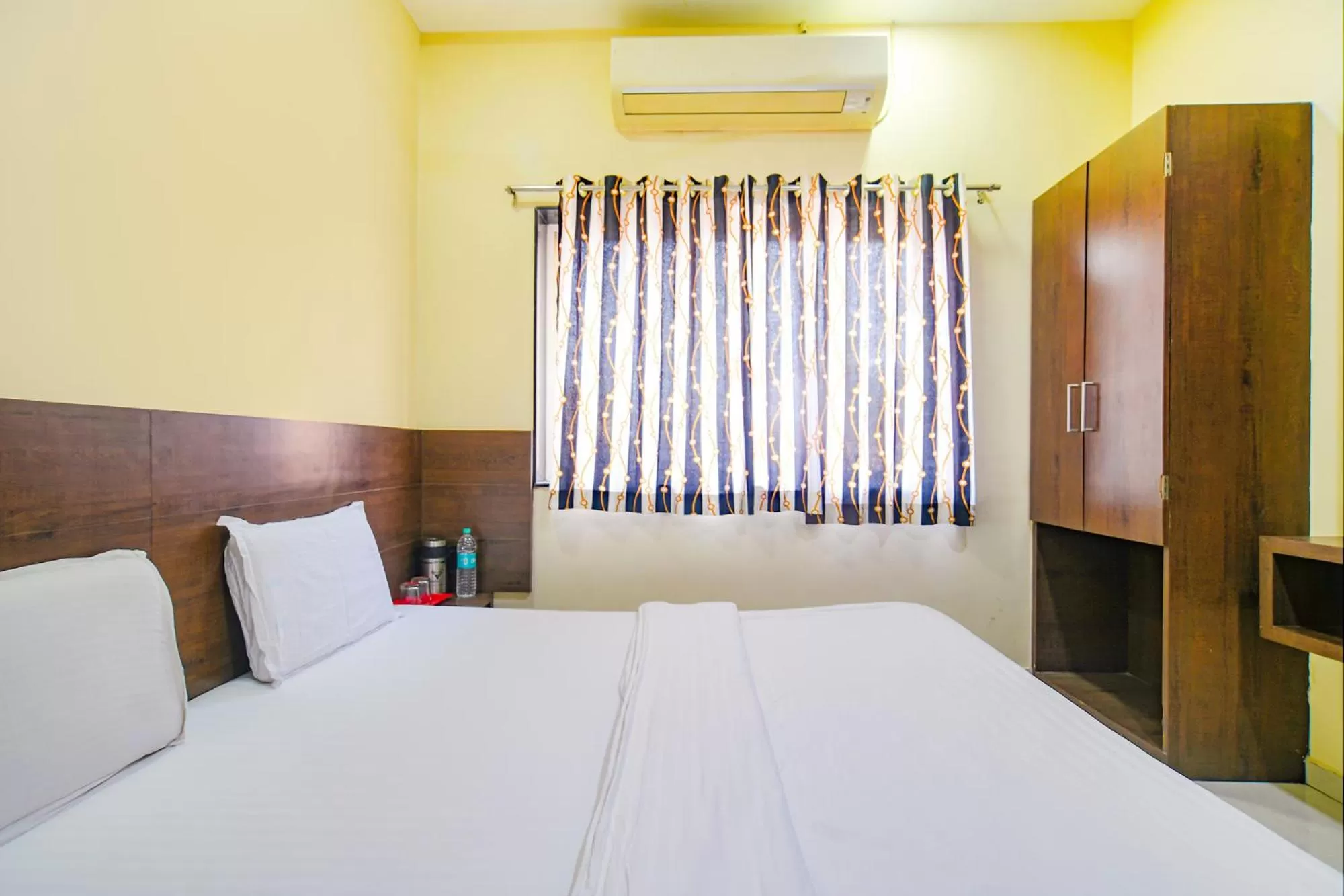 Bed in FabHotel Satyug Jaisinghpura