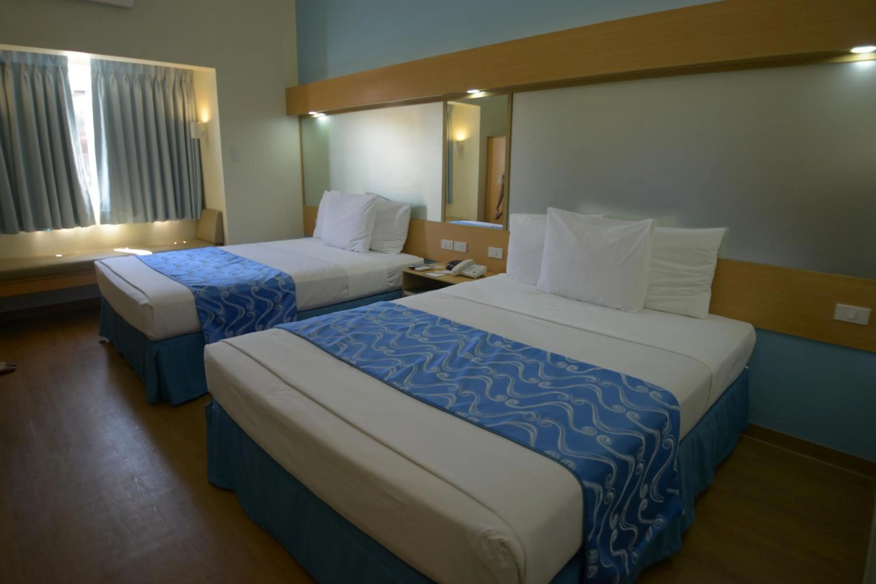 Photo of the whole room, Bed in Microtel by Wyndham Davao
