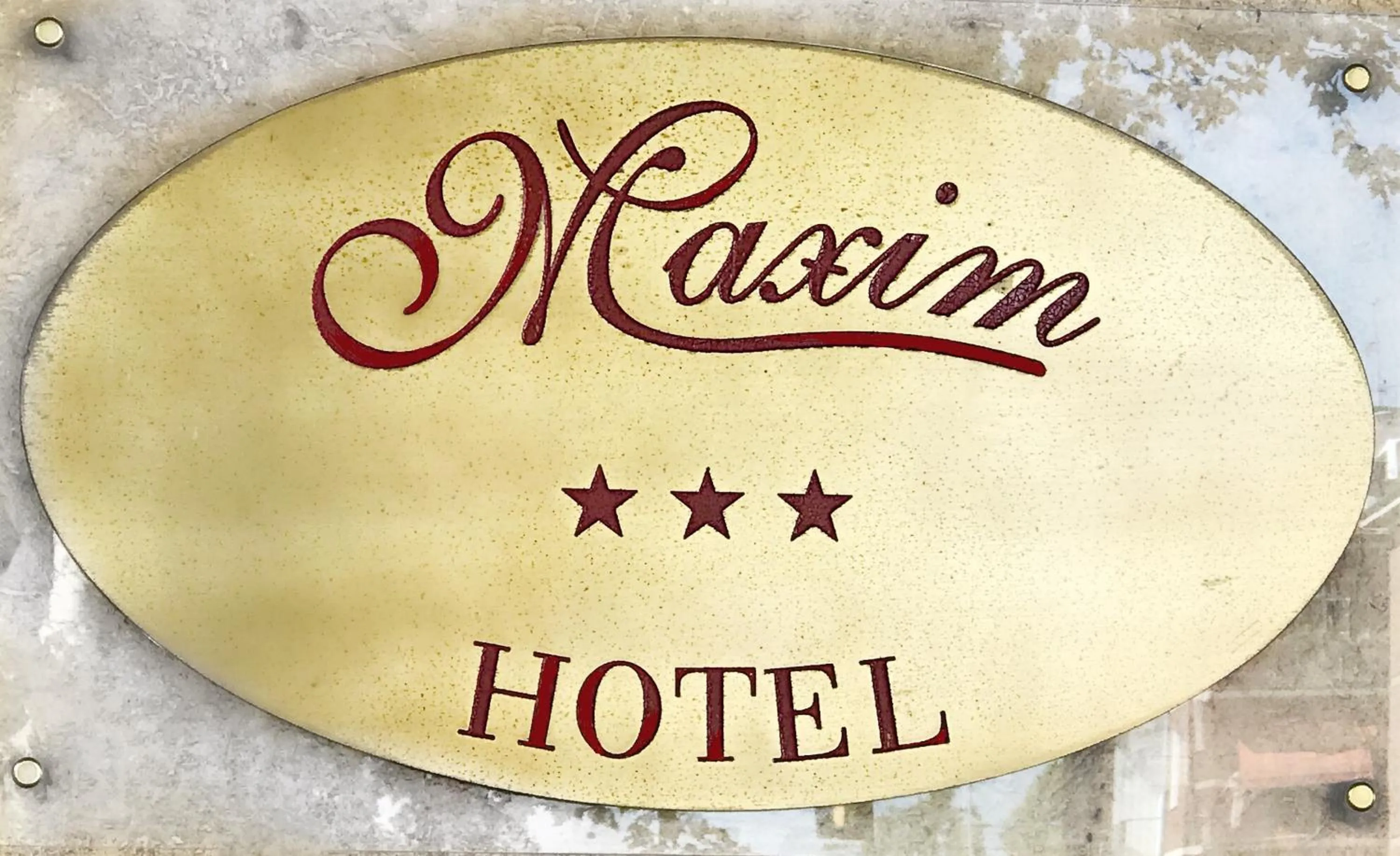 Property logo or sign in Hotel Maxim