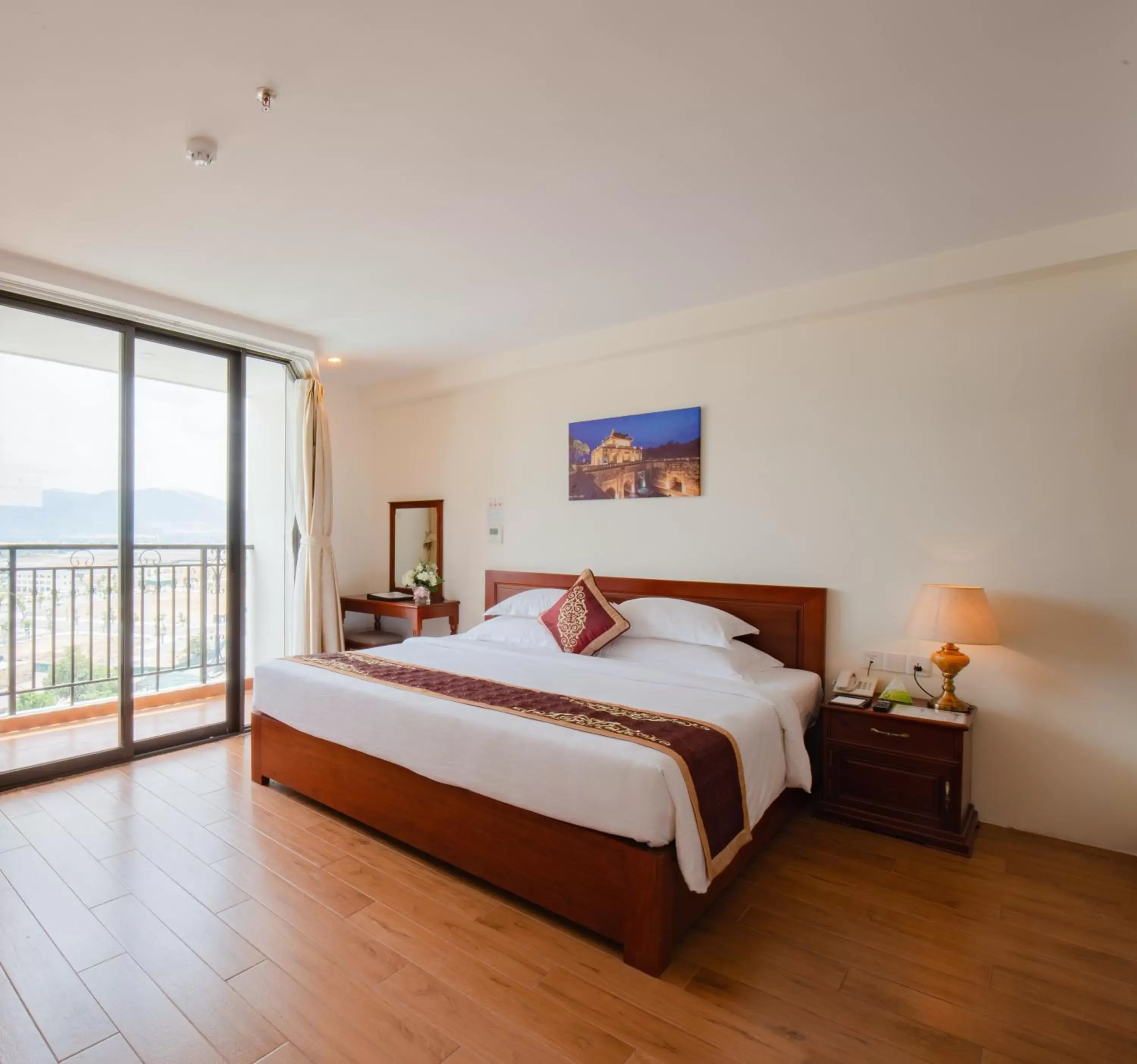 Deluxe Double Room with Balcony and Sea View in Red Sun Nha Trang Hotel Deluxe Double Room with Balcony and Sea View in Red Sun Nha Trang Hotel