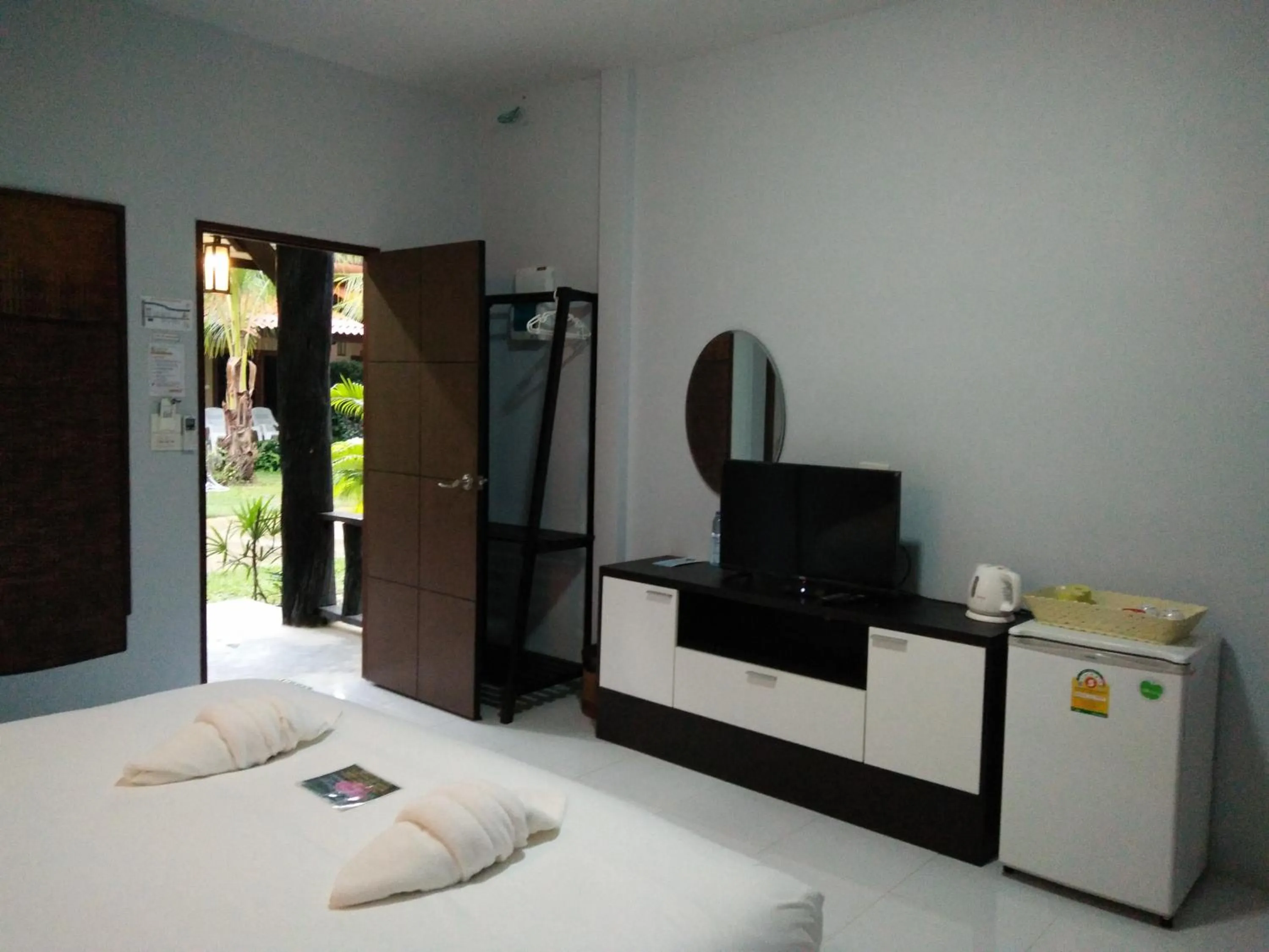 Bed in Baan Suan Rim Klong Resort