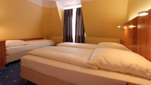 Bed in Aparthotel Astro - Nichtraucherhotel