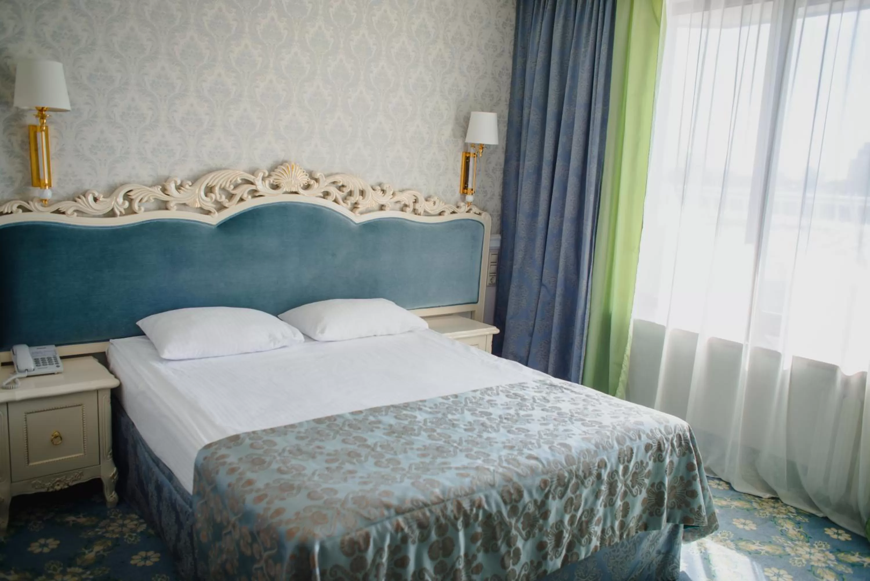 Bed in Royal Olympic Hotel