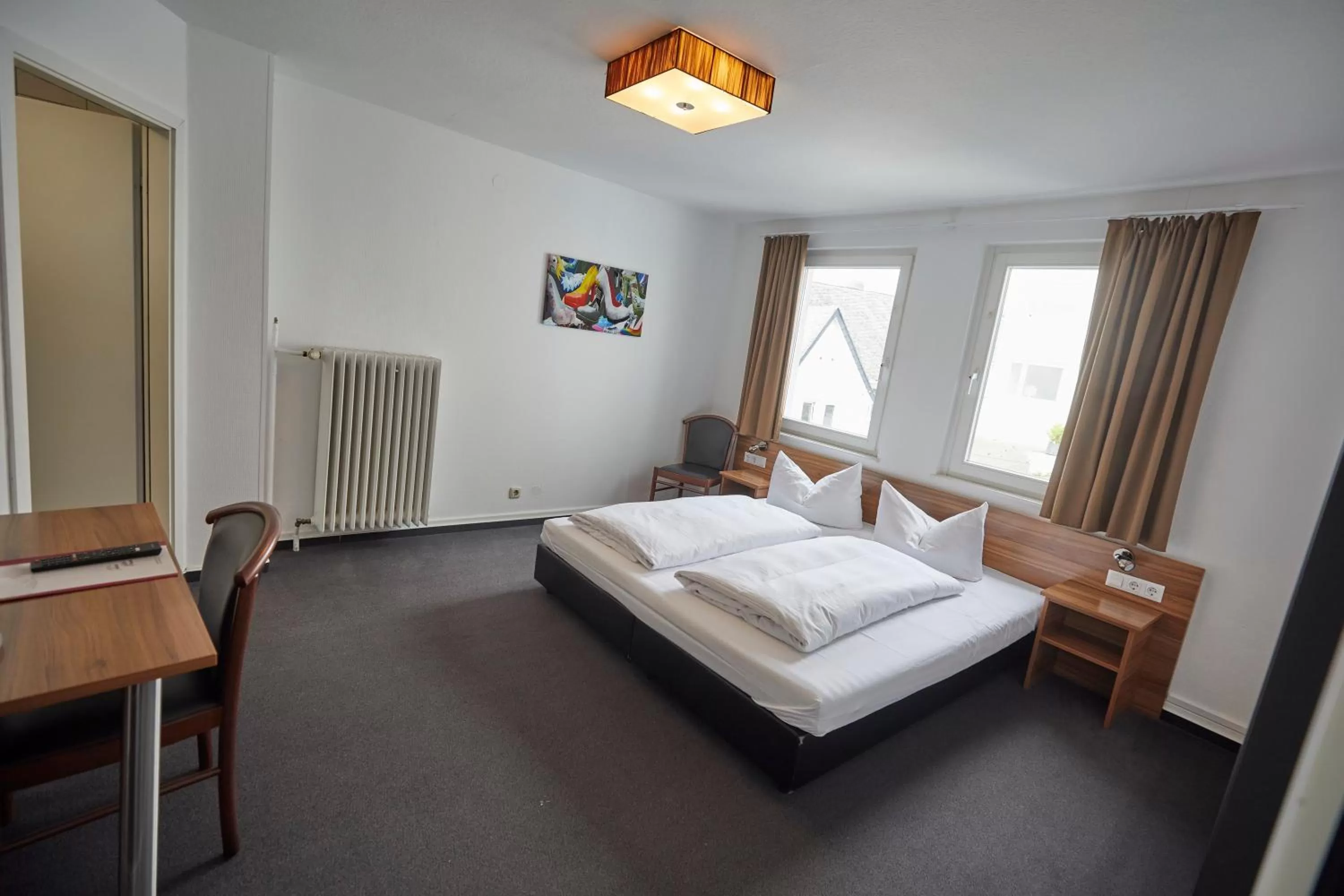 Photo of the whole room, Bed in Hotel Schlemmer Das familäre Altstadt - Hotel mit Herz