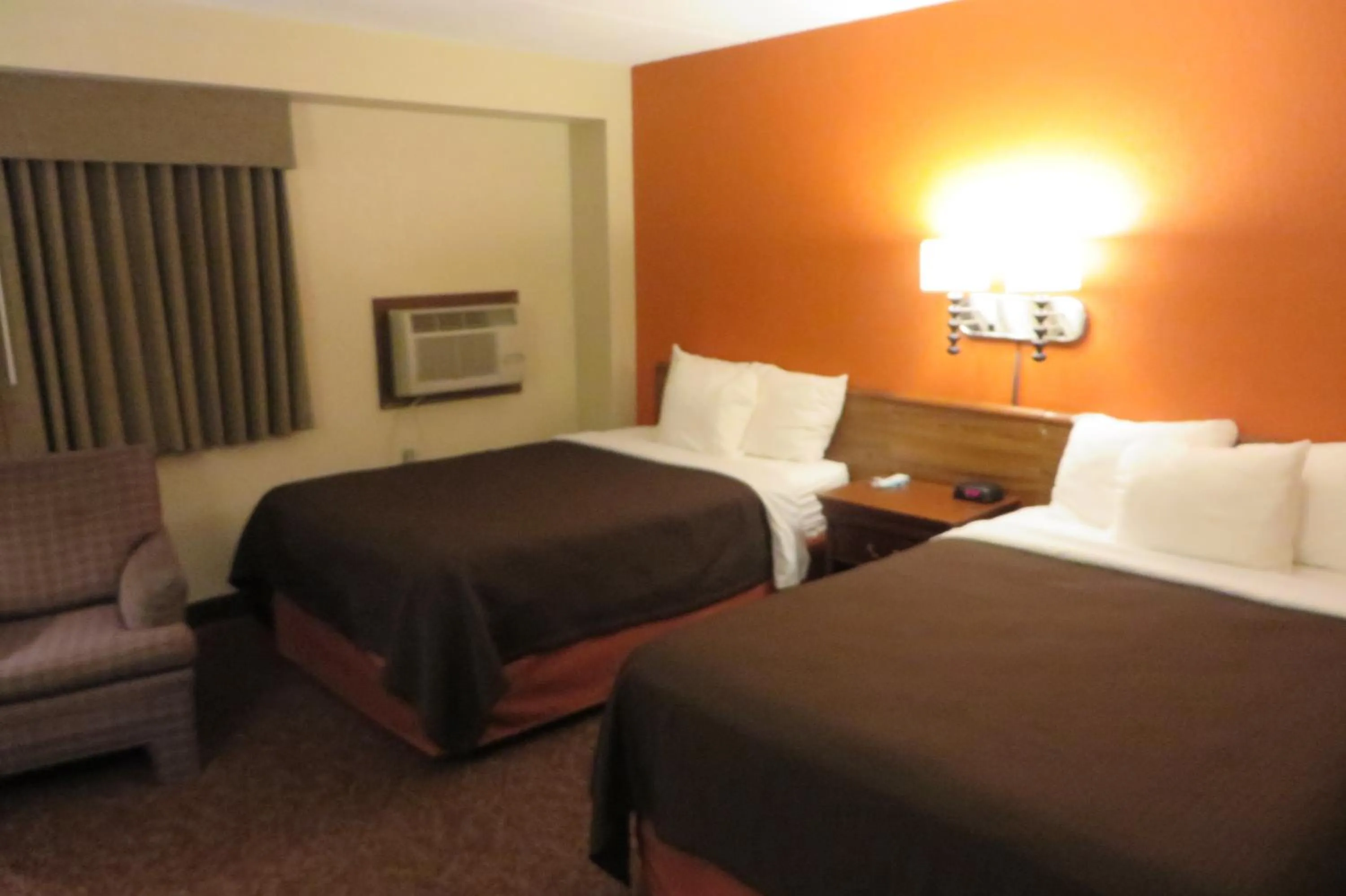 Bed in AmericInn by Wyndham Forest Lake