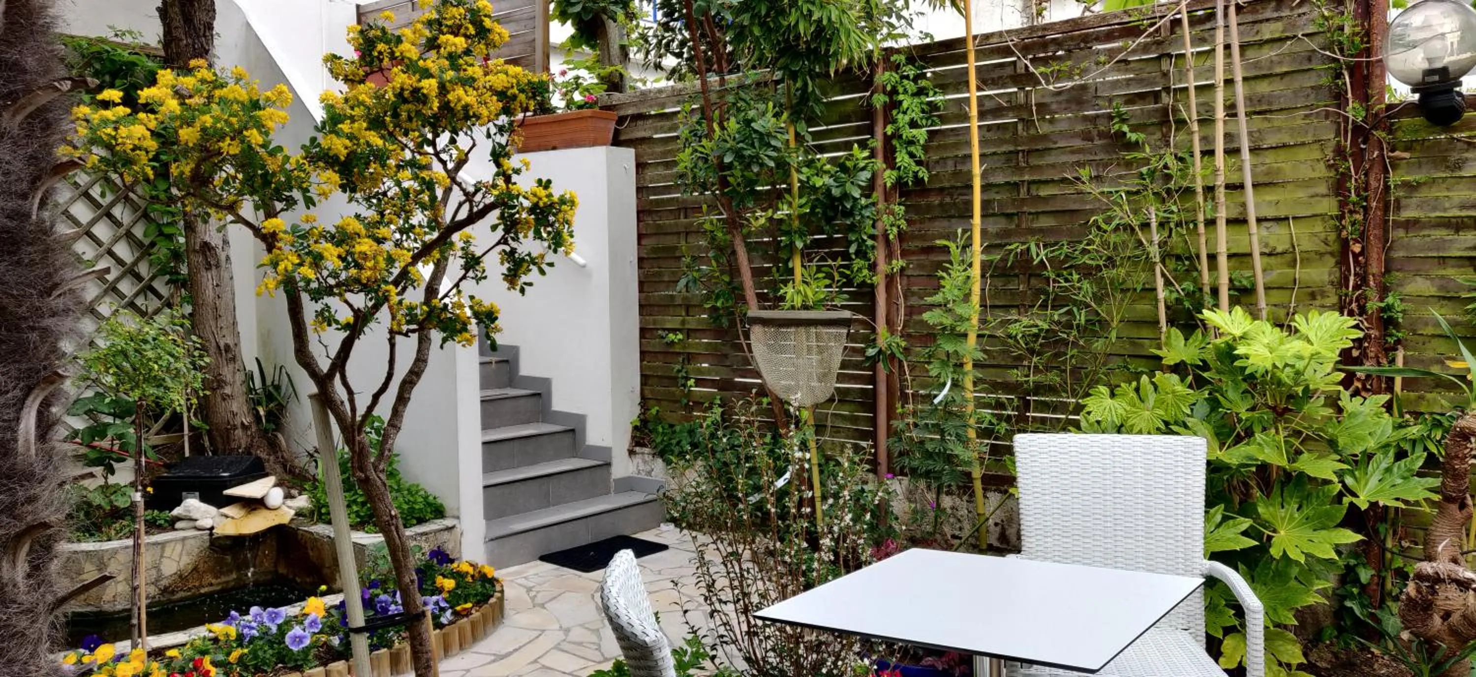 Patio in Logis Hôtel Les Bleuets