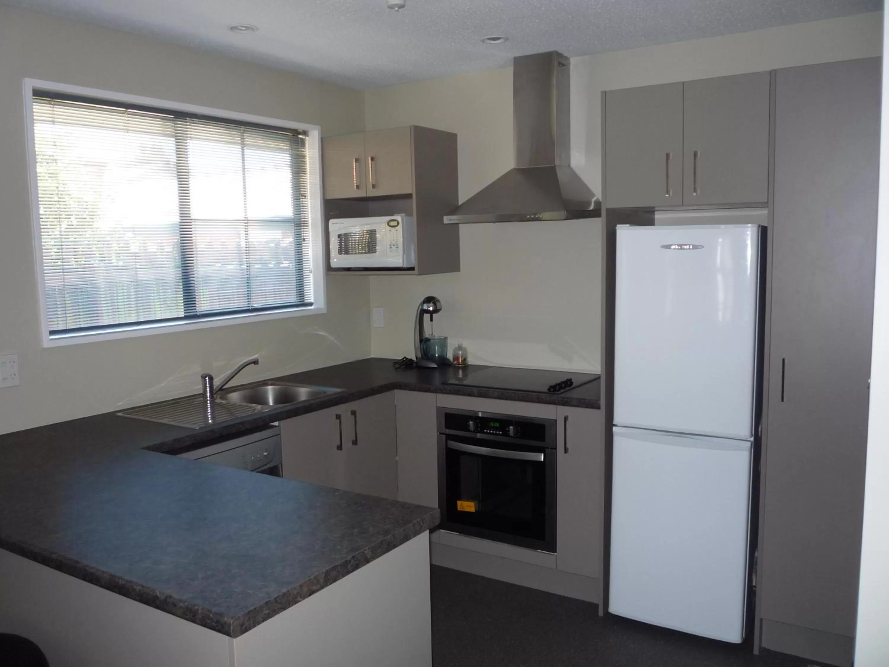 Kitchen or kitchenette in Metropolitan Motel on Riccarton - 2 mins walk to Westfield