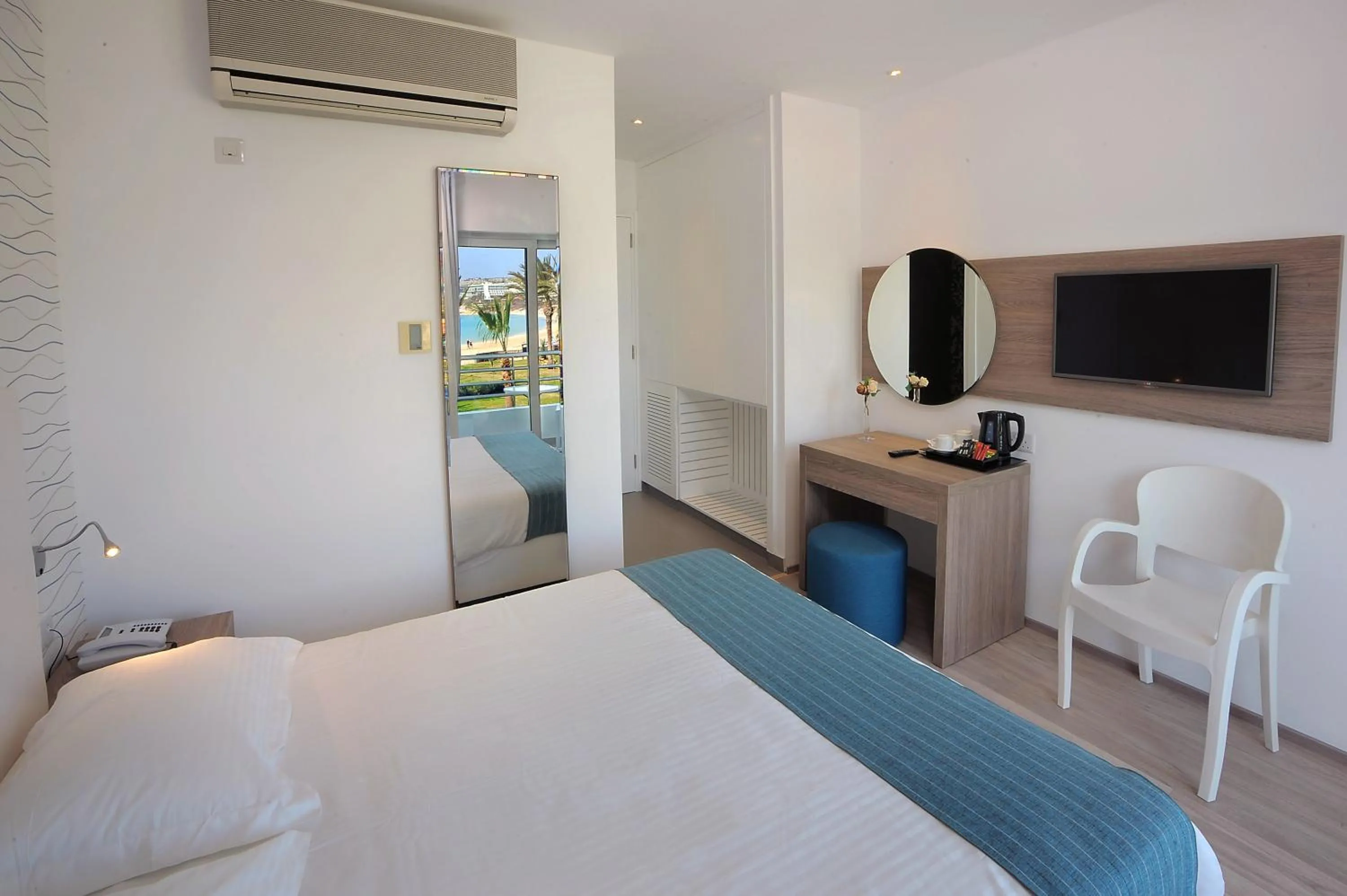 Bed in Okeanos Beach Boutique Hotel