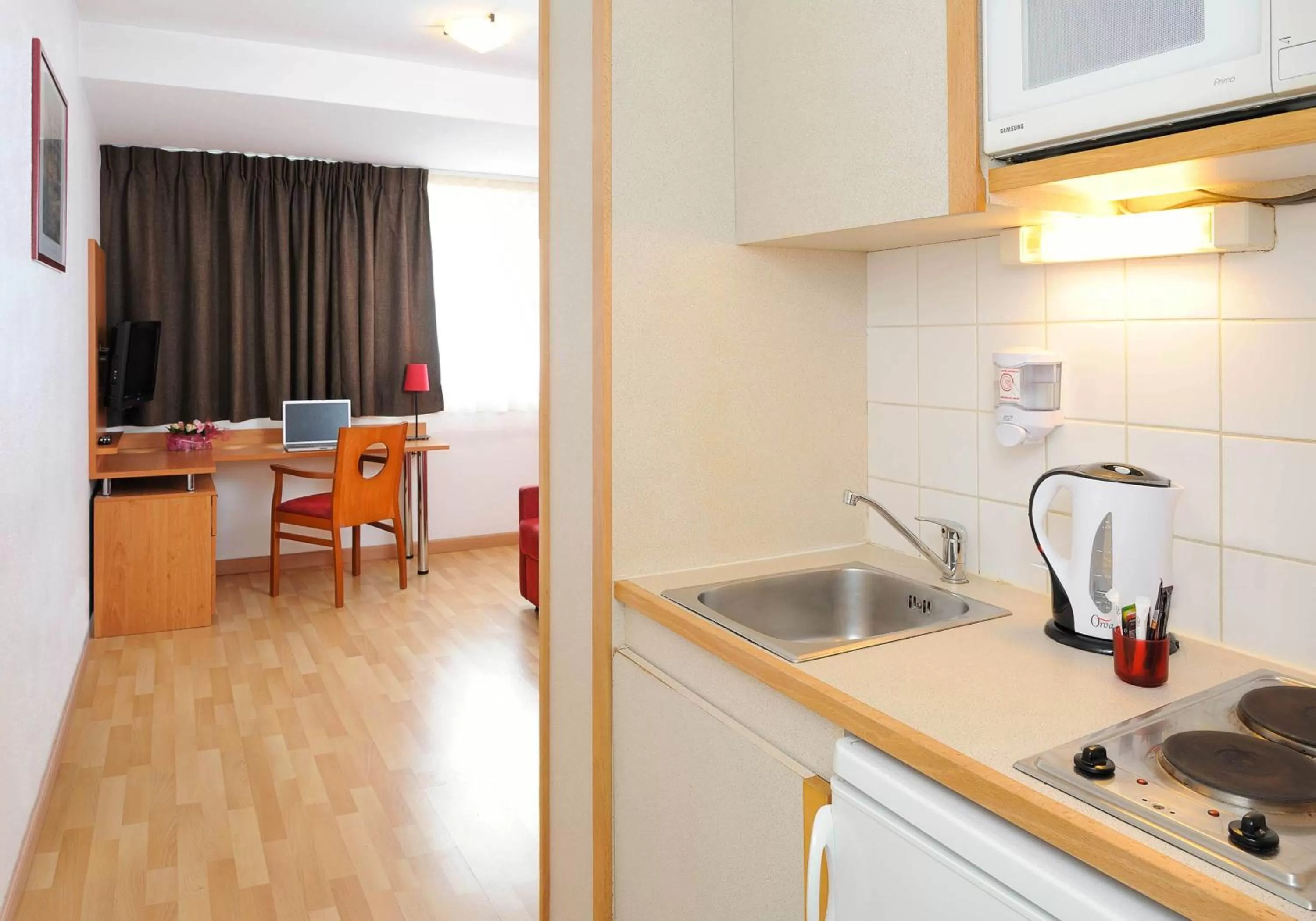 Kitchen or kitchenette in Séjours & Affaires Tours Léonard De Vinci