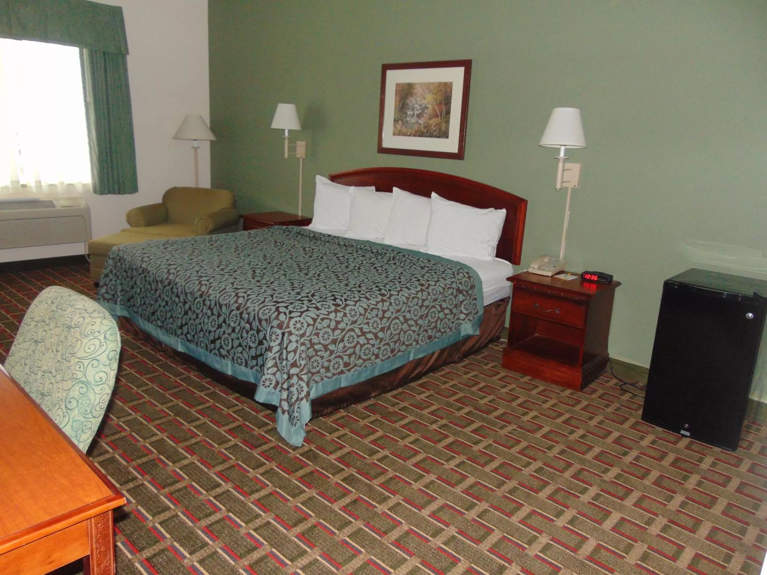 Seating area, Bed in Days Inn by Wyndham Pentwater