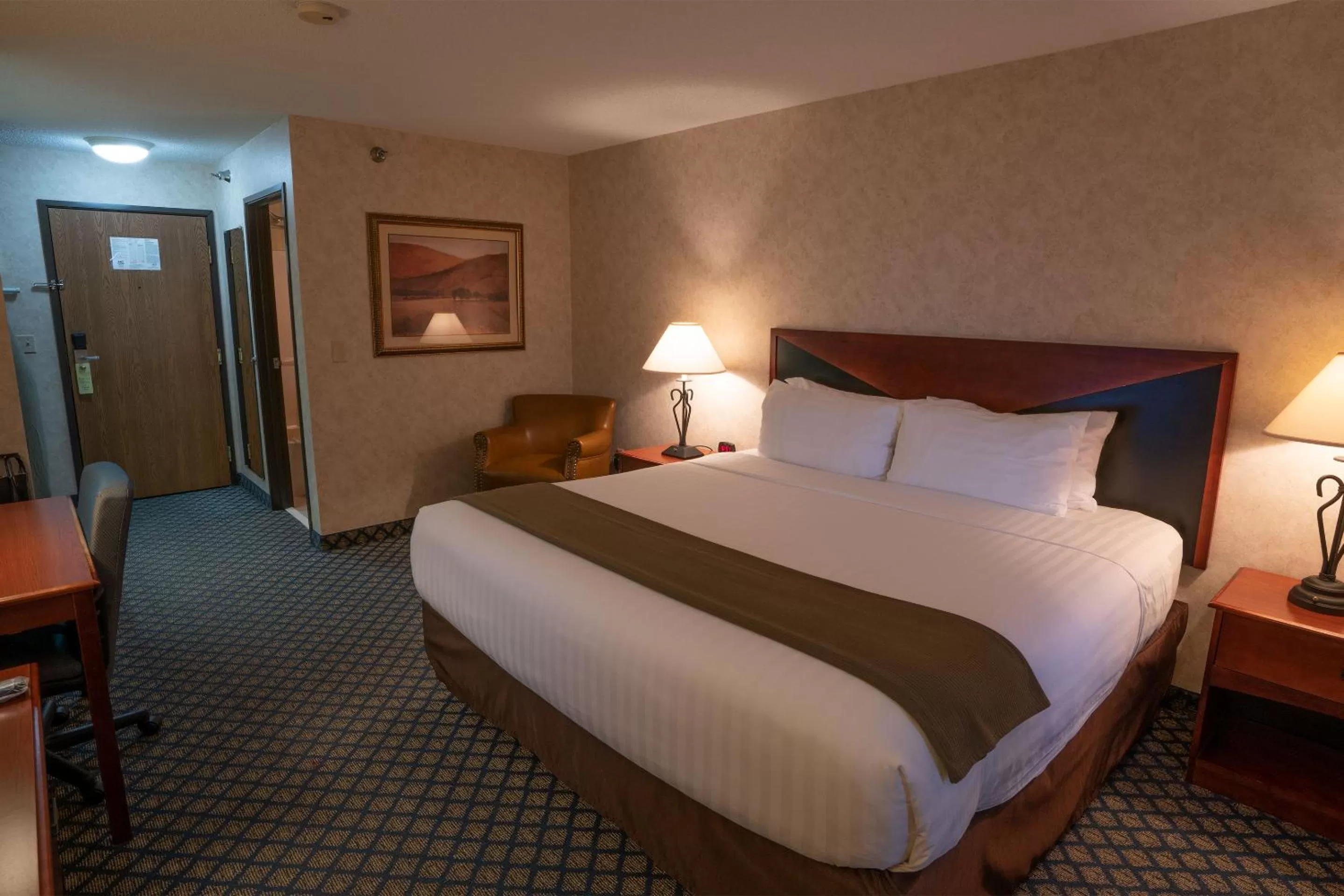 Bed in Miles City Hotel & Suites