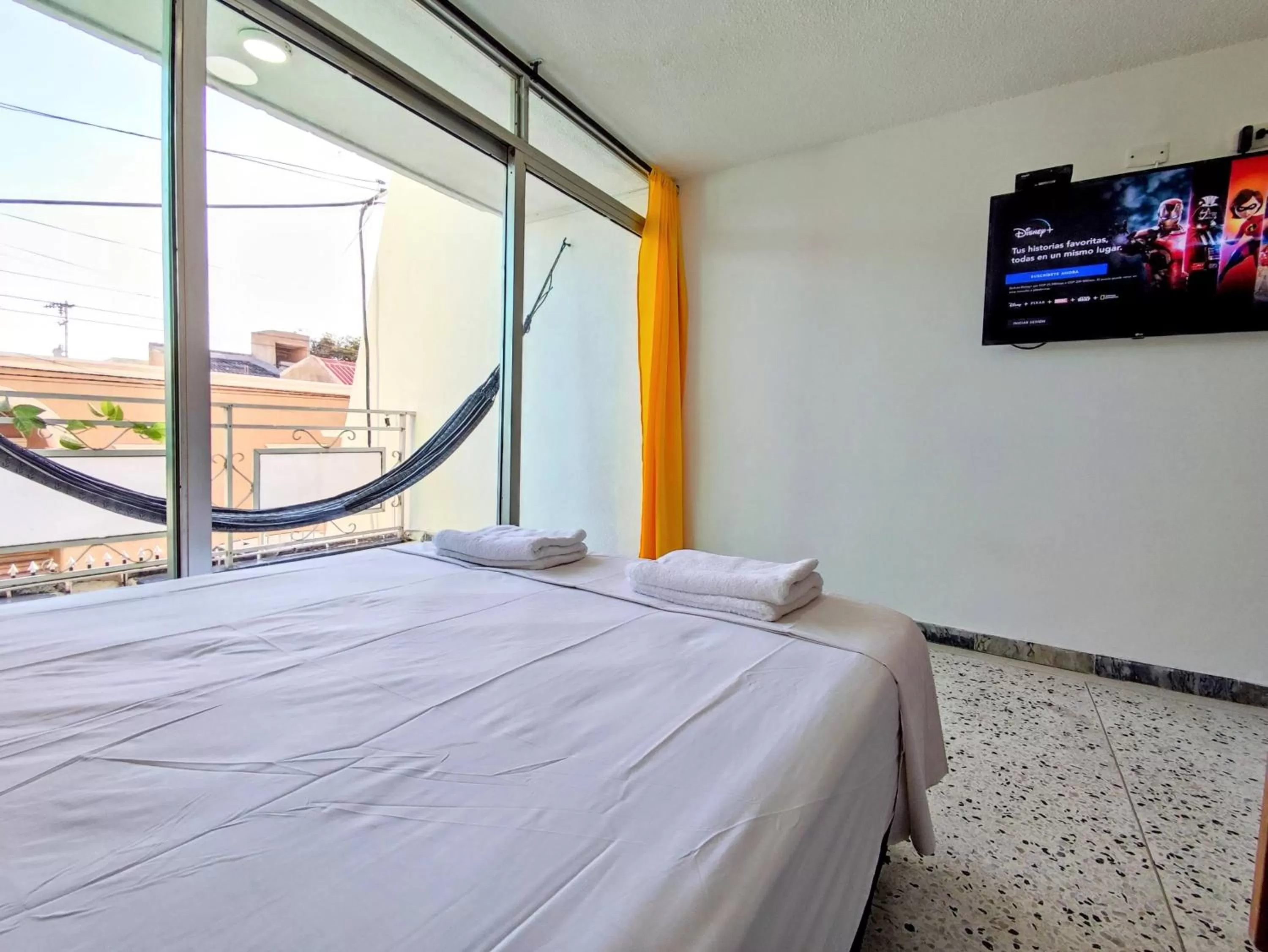 Bed in Bona Vida Hotel