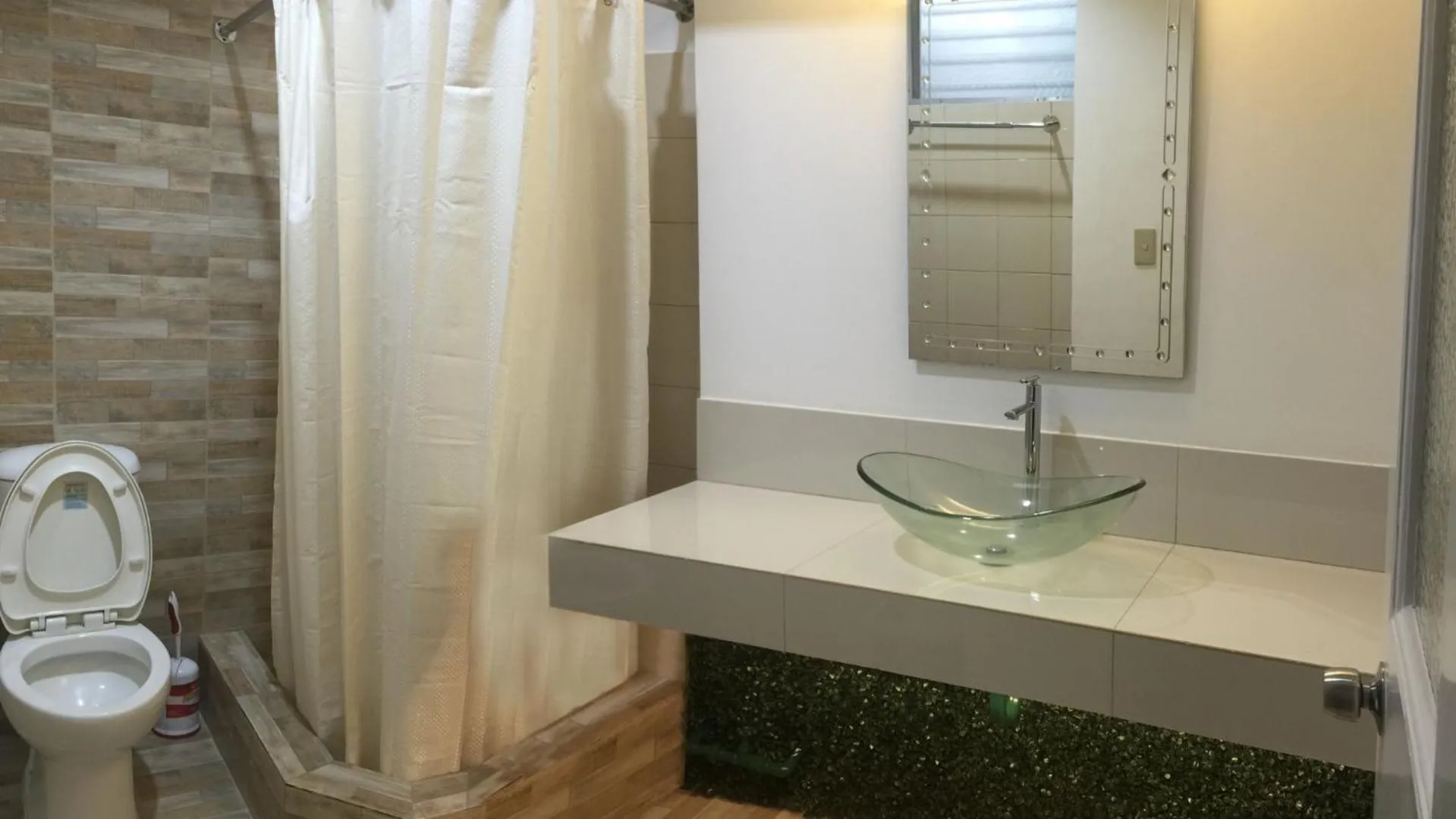 Toilet in 1775 Adriatico Suites