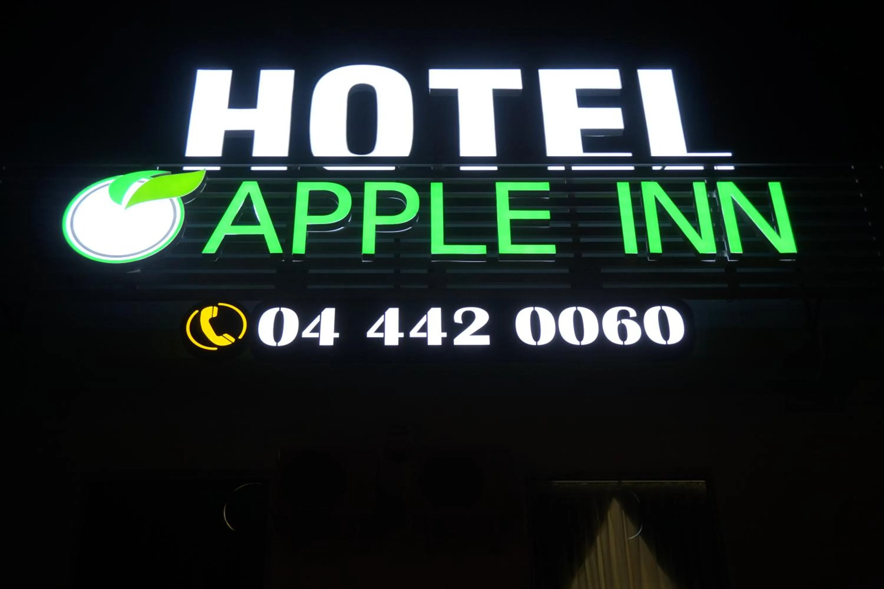 Property logo or sign in Apple Inn Hotel