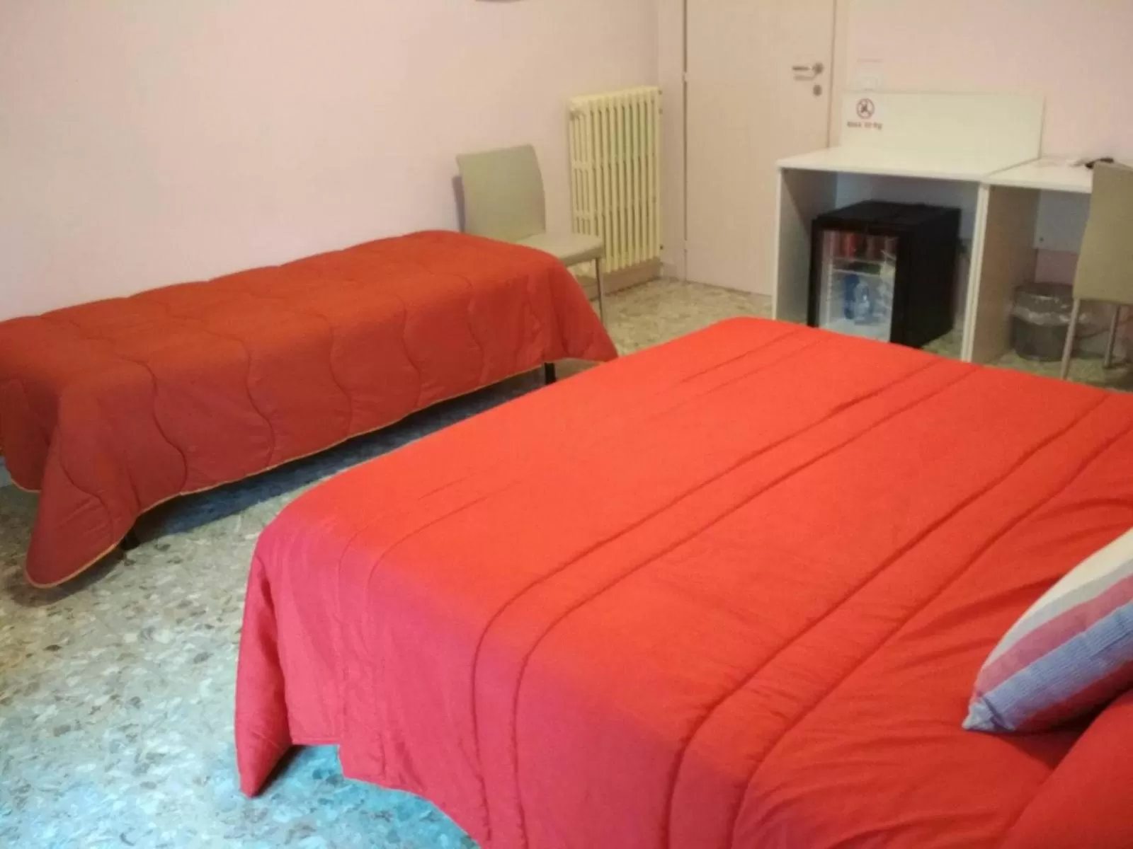 Bed in Michelangelo Rooms