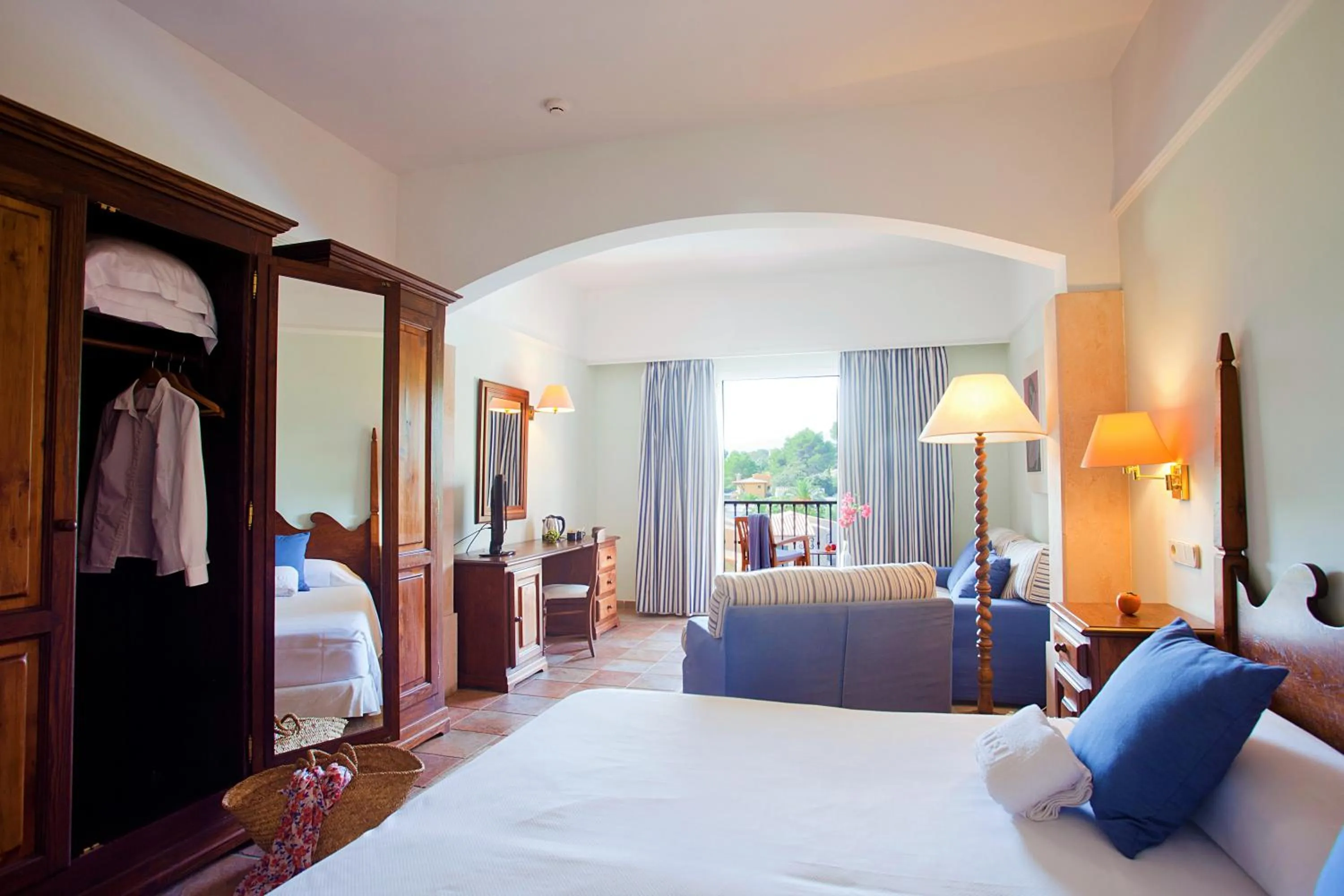 Seating area, Bed in Hotel Cala Sant Vicenç - Adults Only