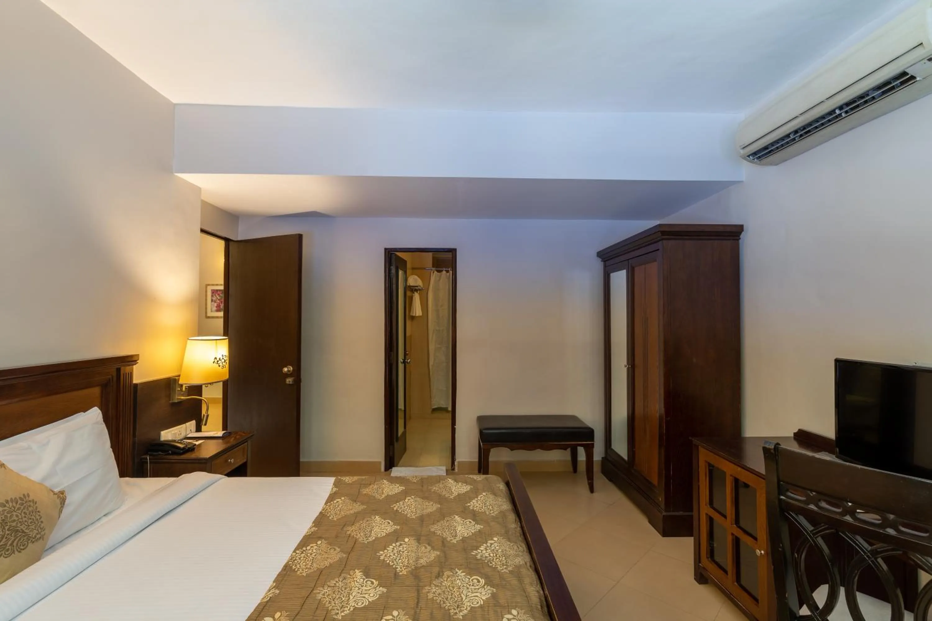 Bed in Neelam's The Grand Hotel Goa