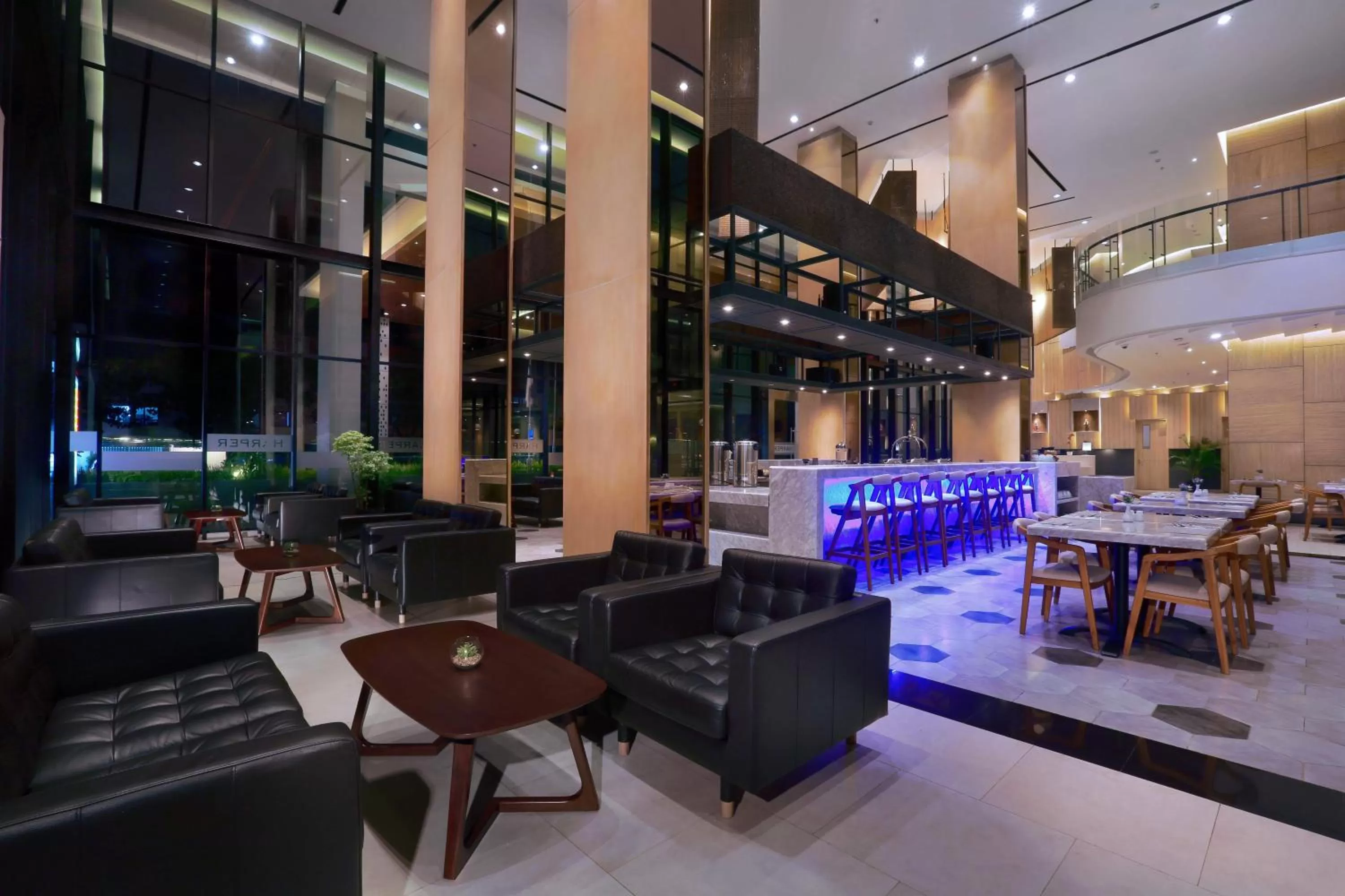 Communal lounge/ TV room in Harper Cikarang by ASTON