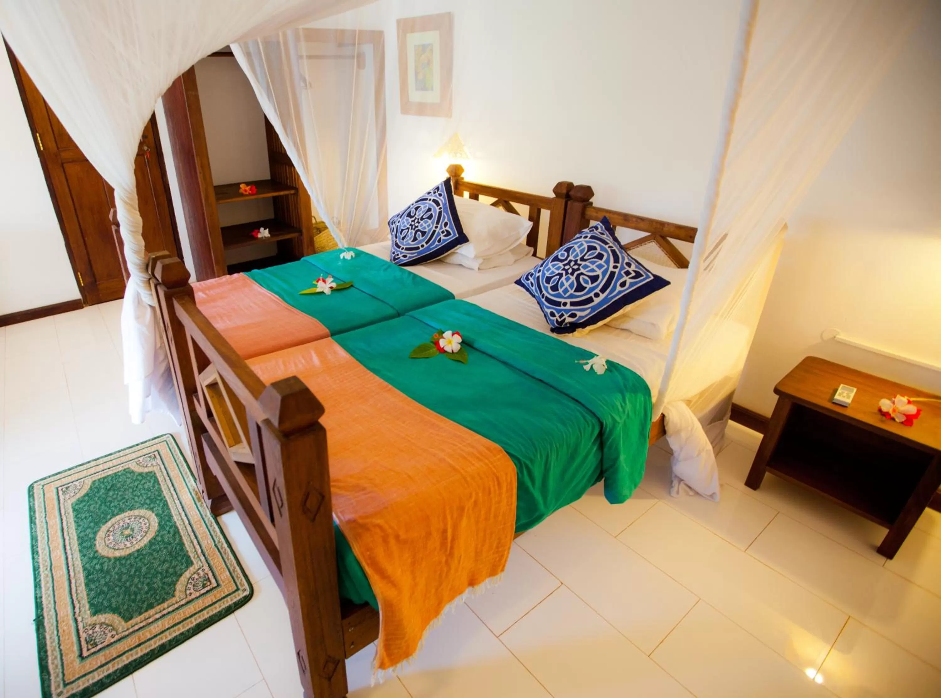 Bed in Flame Tree Cottages