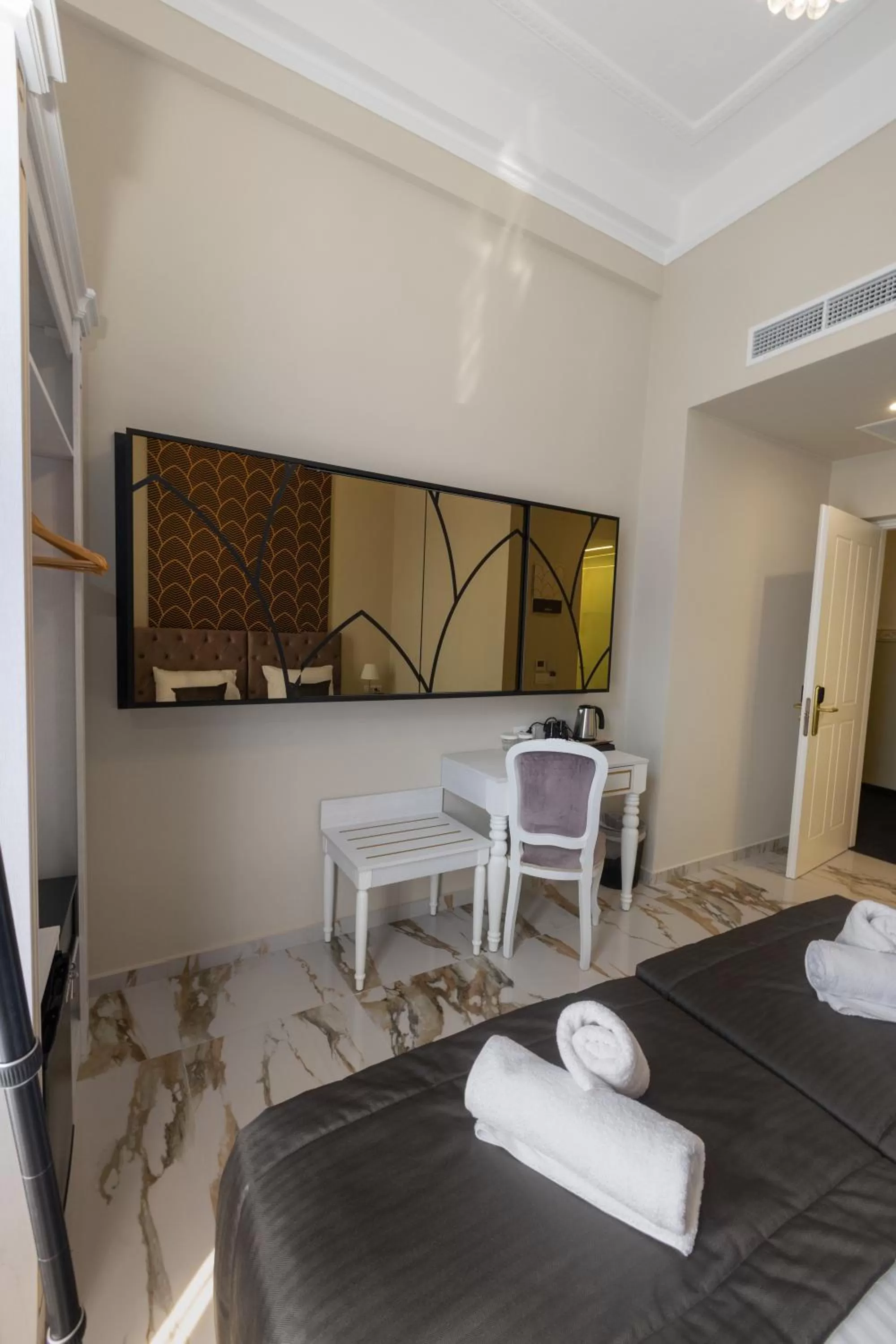 Bed in Modern Revival Luxury Hotel