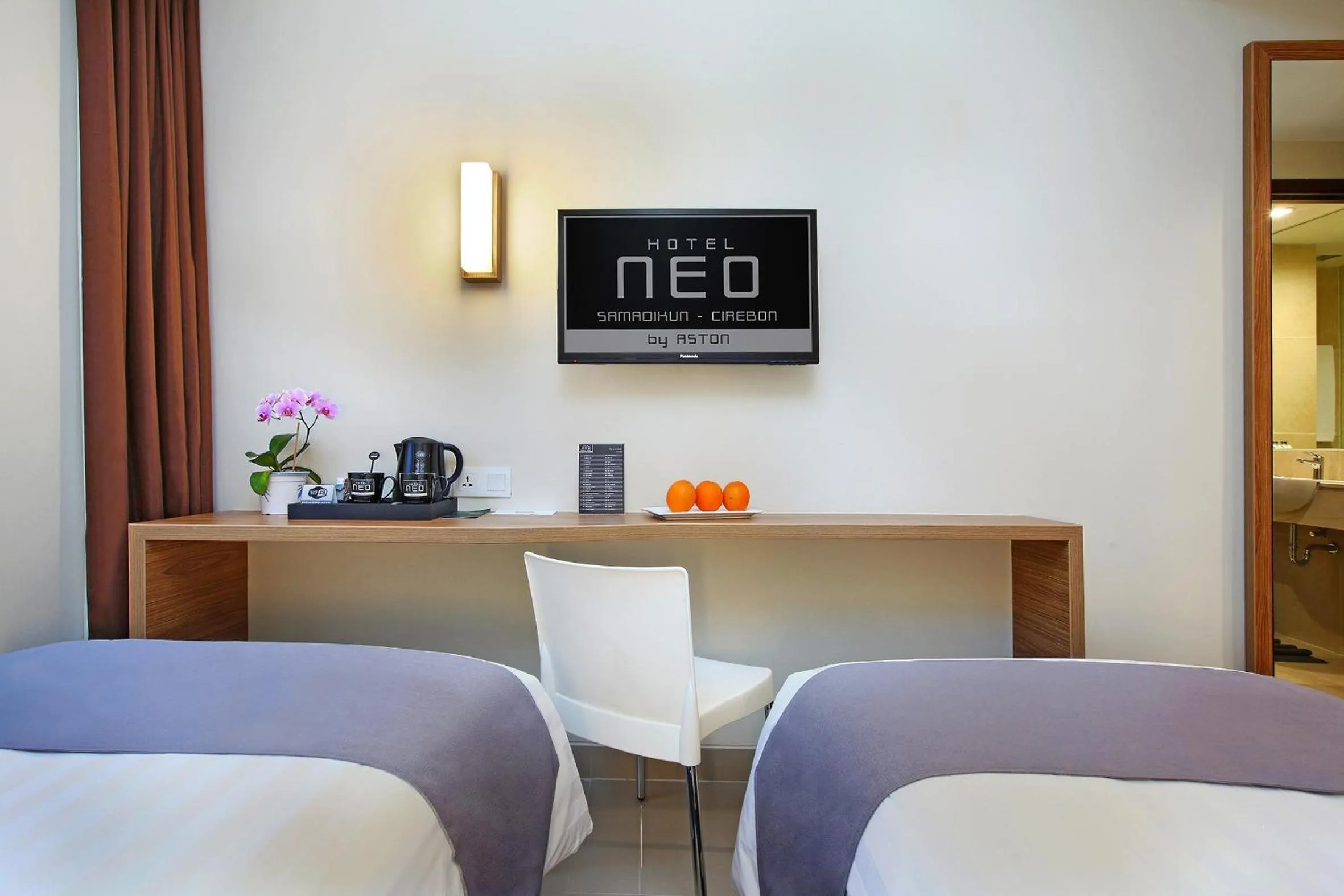 TV and multimedia in Hotel NEO Cirebon by ASTON