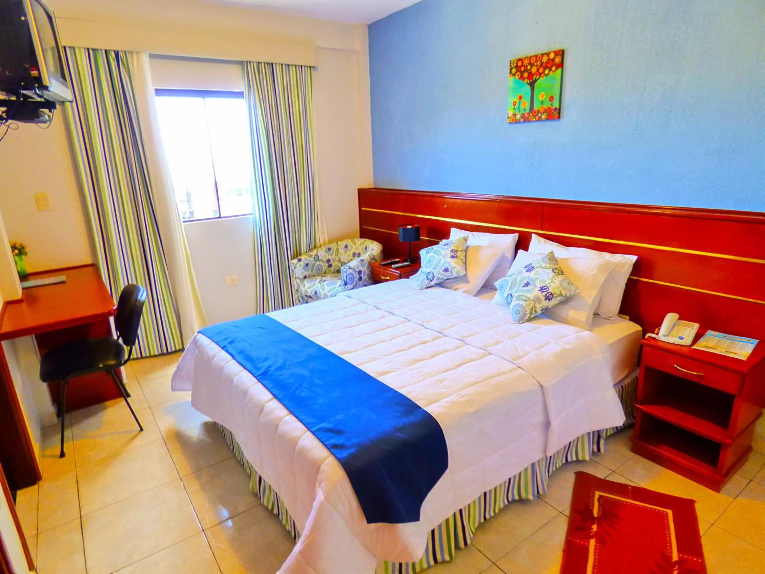 Bed in De La Costa Hotel