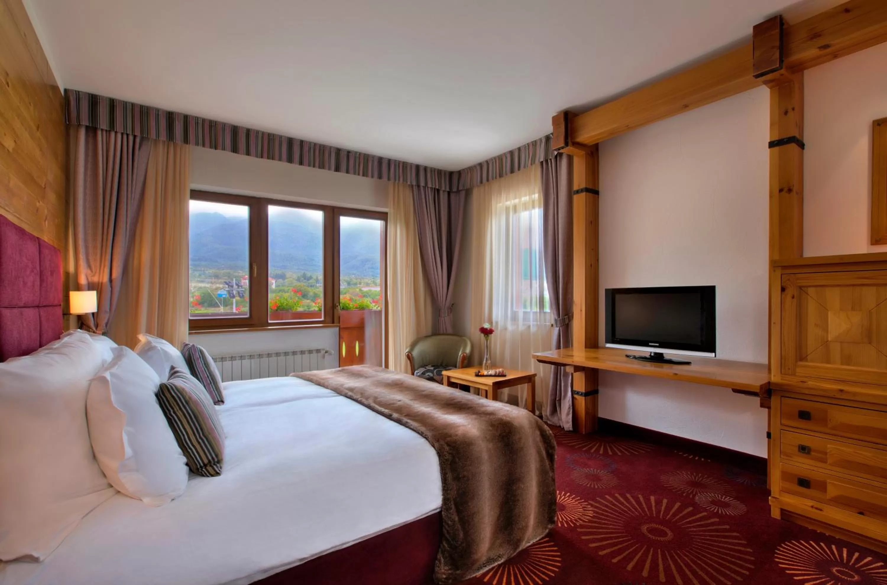 Photo of the whole room, Bed in Kempinski Hotel Grand Arena Bansko