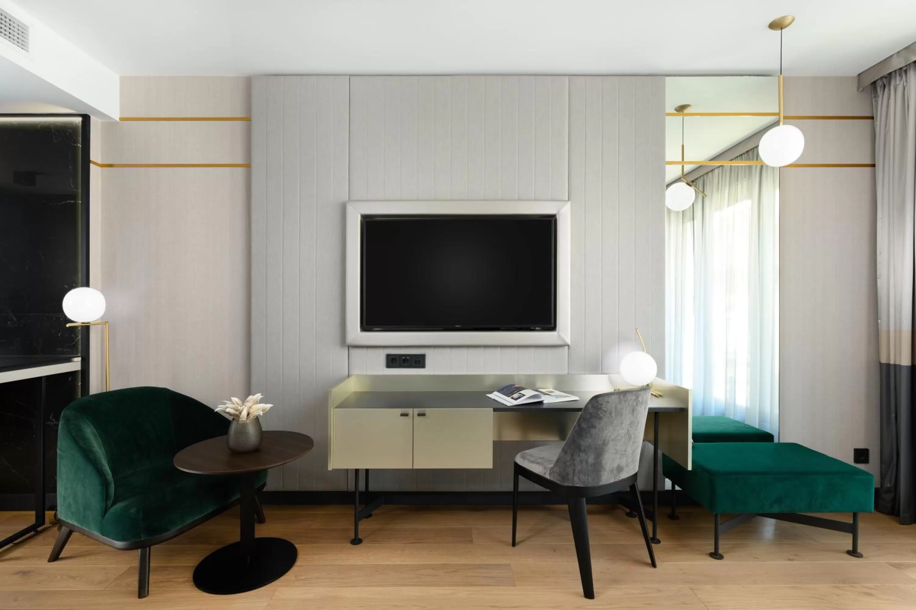 Bed in Emerald Downtown Luxury Suites by Continental Group