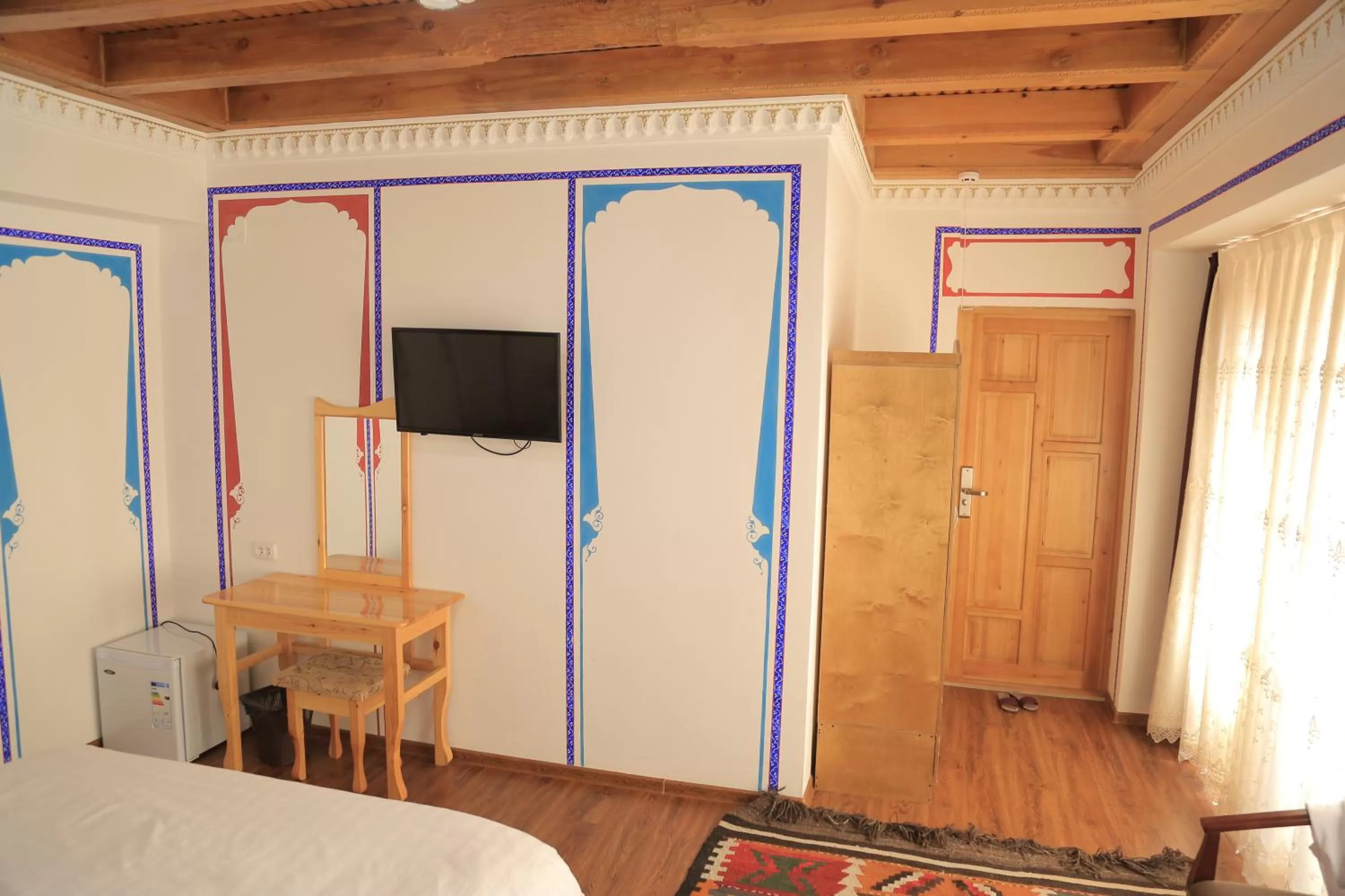 Bed, TV/Entertainment Center in As-Salam Boutique Hotel