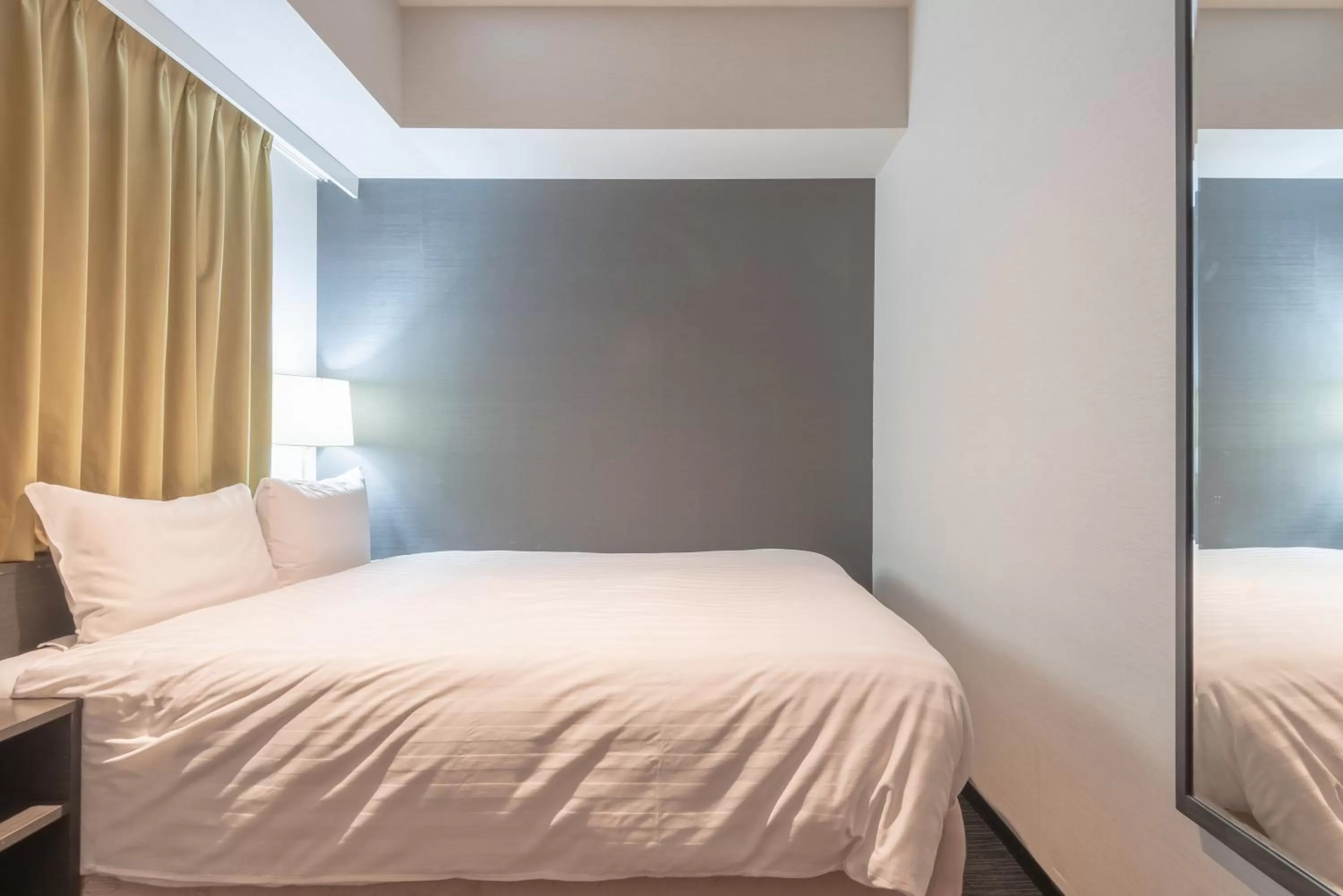 Bed in E Hotel Higashi Shinjuku