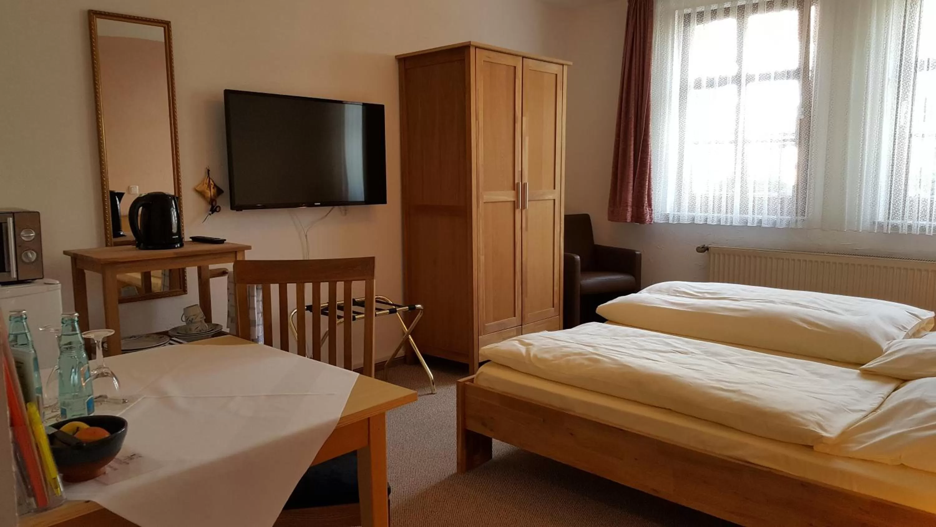 Photo of the whole room, Bed in Hotel Goldflair am Rathaus