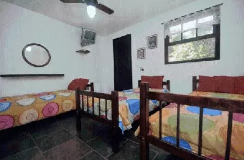 Bed in Pousada A Marca do Faraó