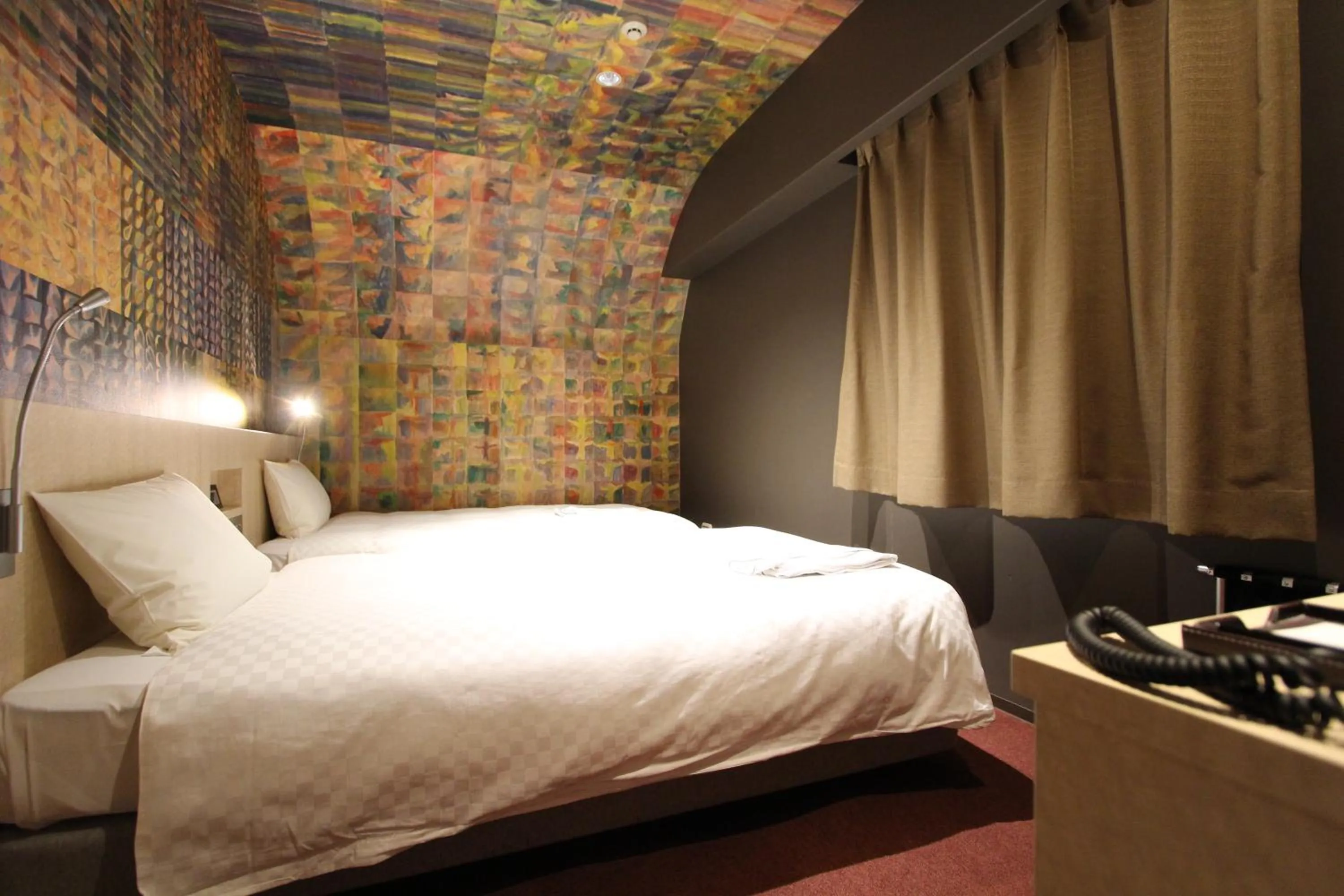 Bed in KOKO HOTEL Osaka Namba Ebisucho