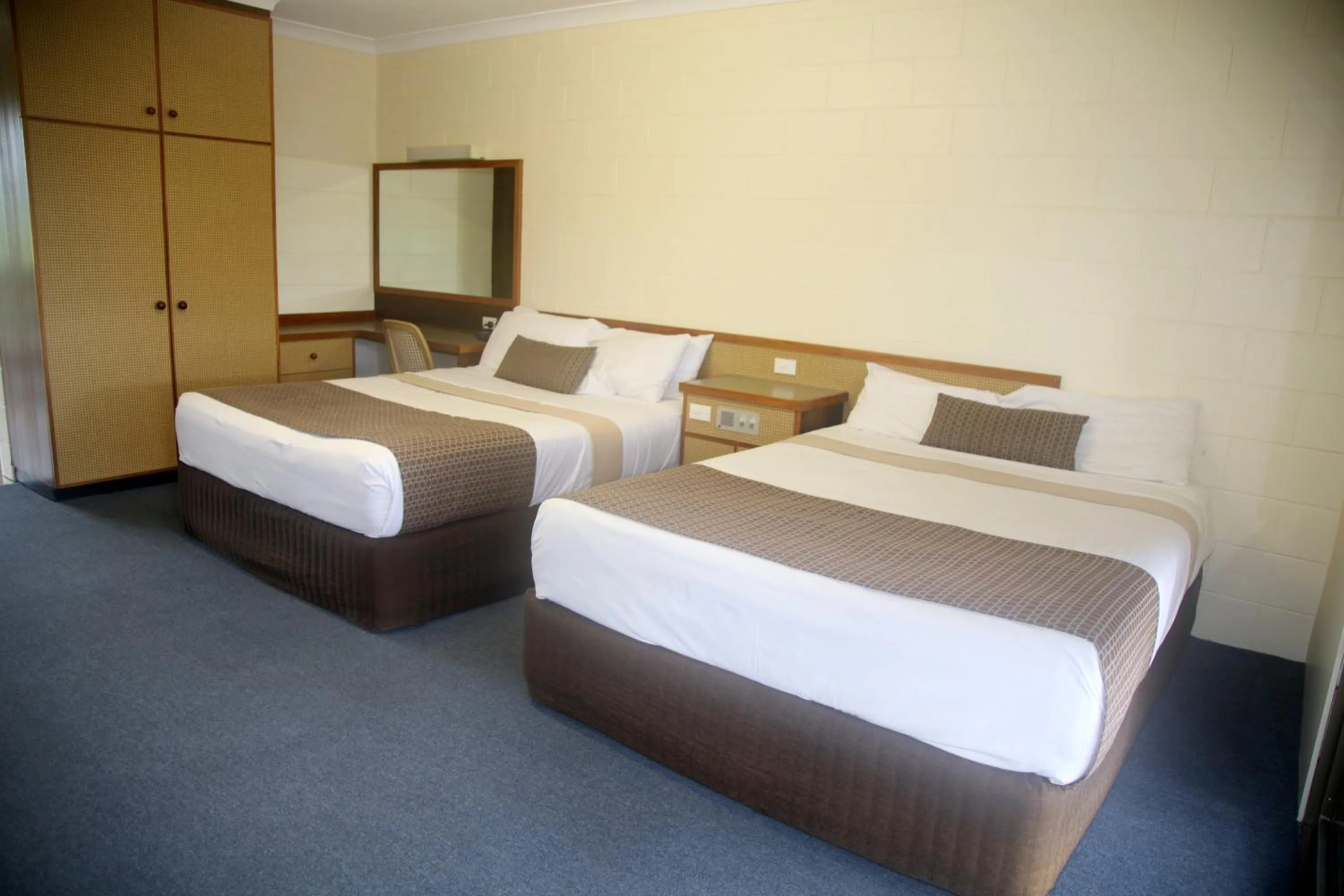 Bed in Reef Gateway Hotel