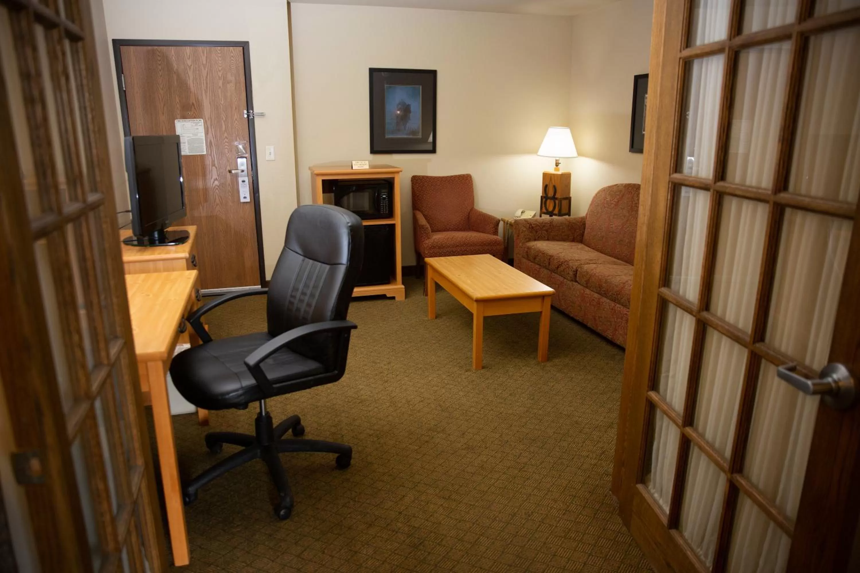 Living room in AmericInn by Wyndham Pampa Event Center
