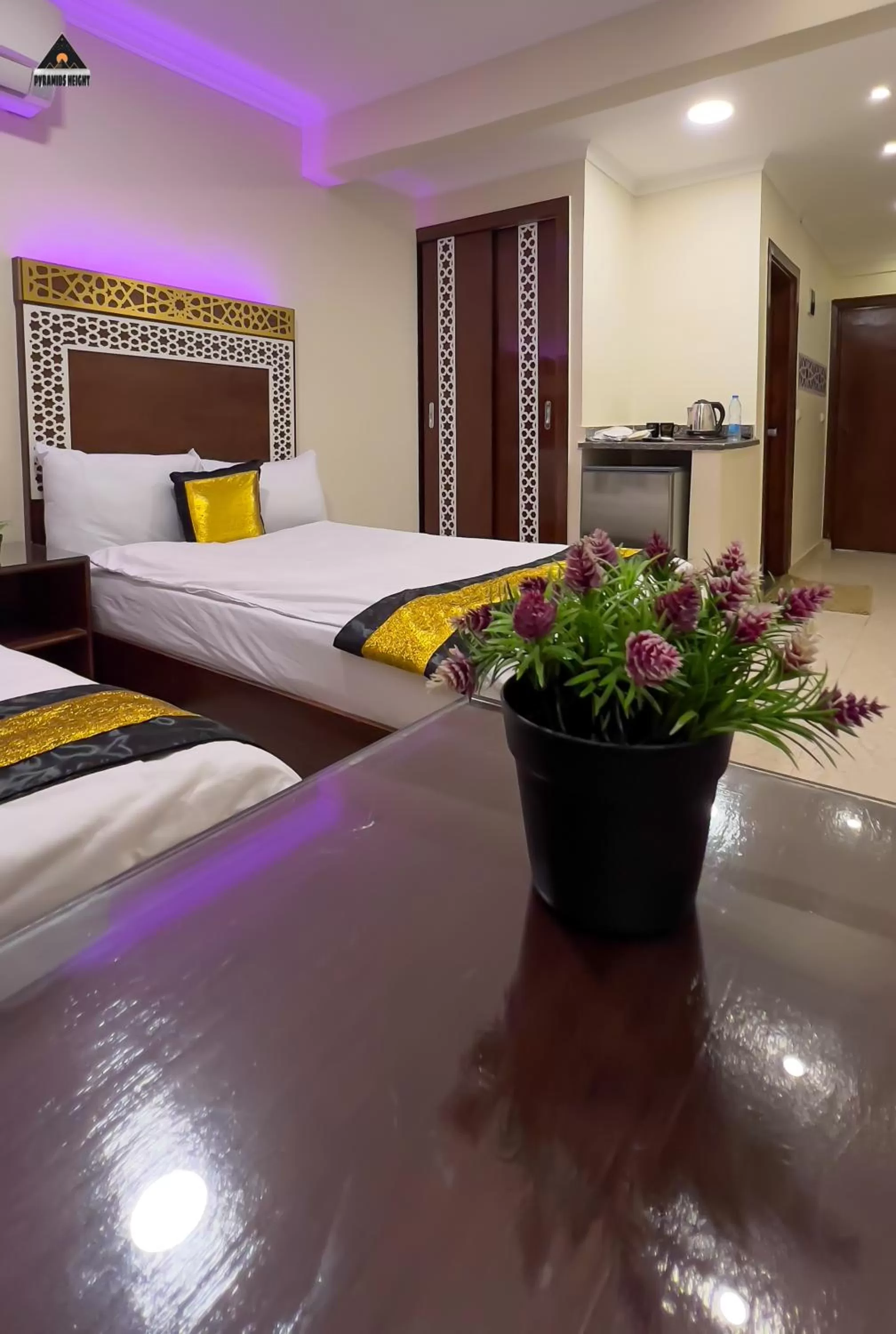 Bed in Pyramids Height Hotel & Pyramids Master Scene Rooftop