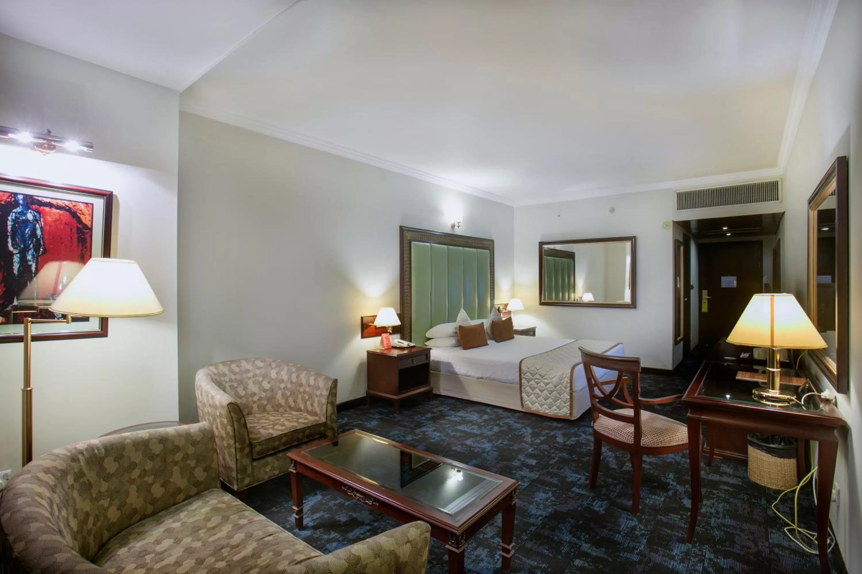 Seating area, Bed in Hotel Sarina