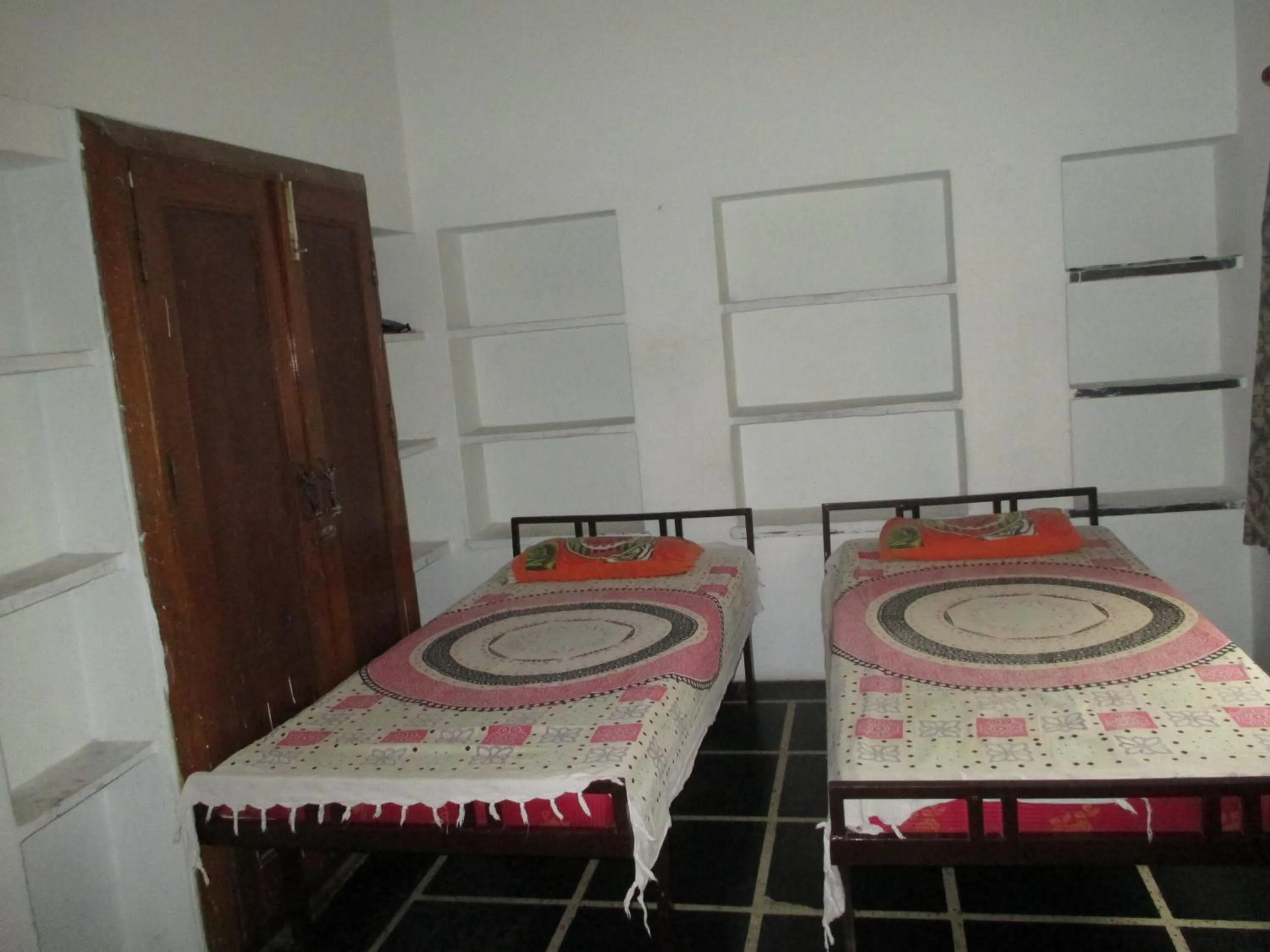 Bed in Udai Haveli Guest House